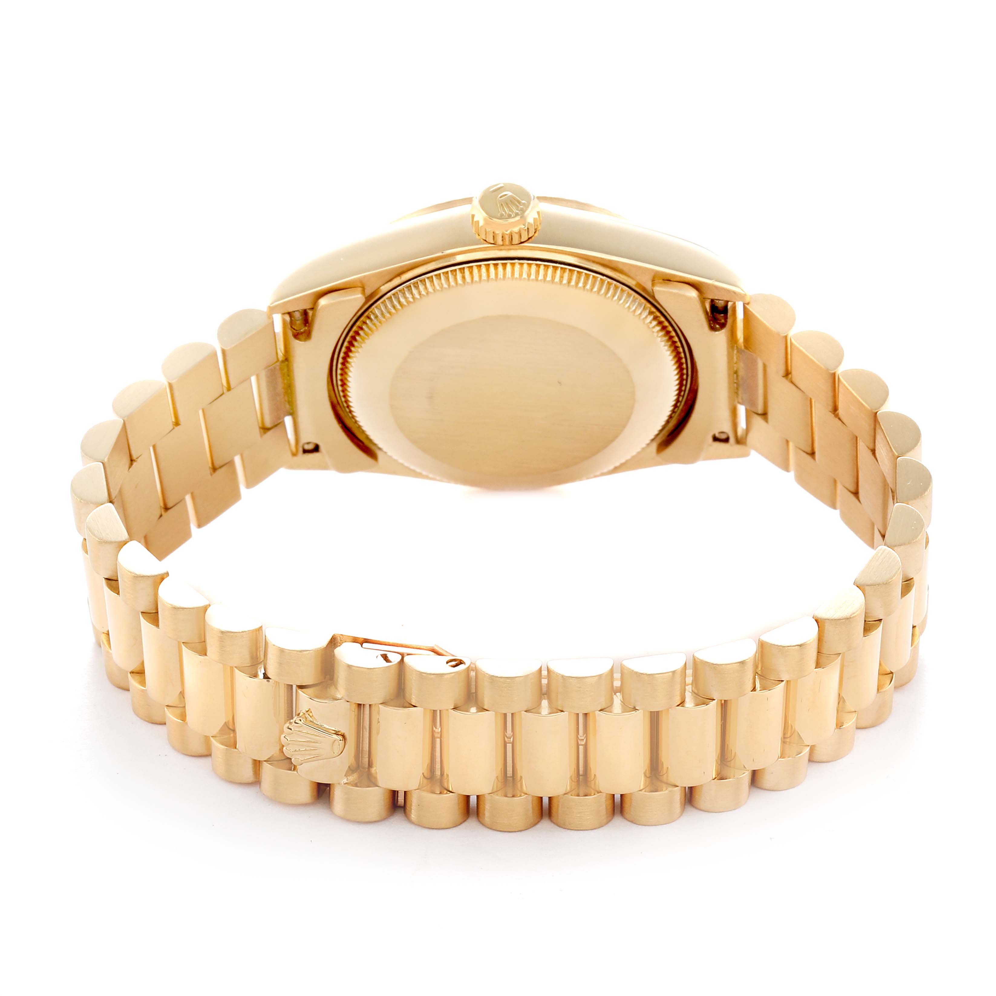 The image shows the Rolex President 68278 Women
s Yellow Gold Black Dial model from the back, highlighting its case back, crown, and bracelet.