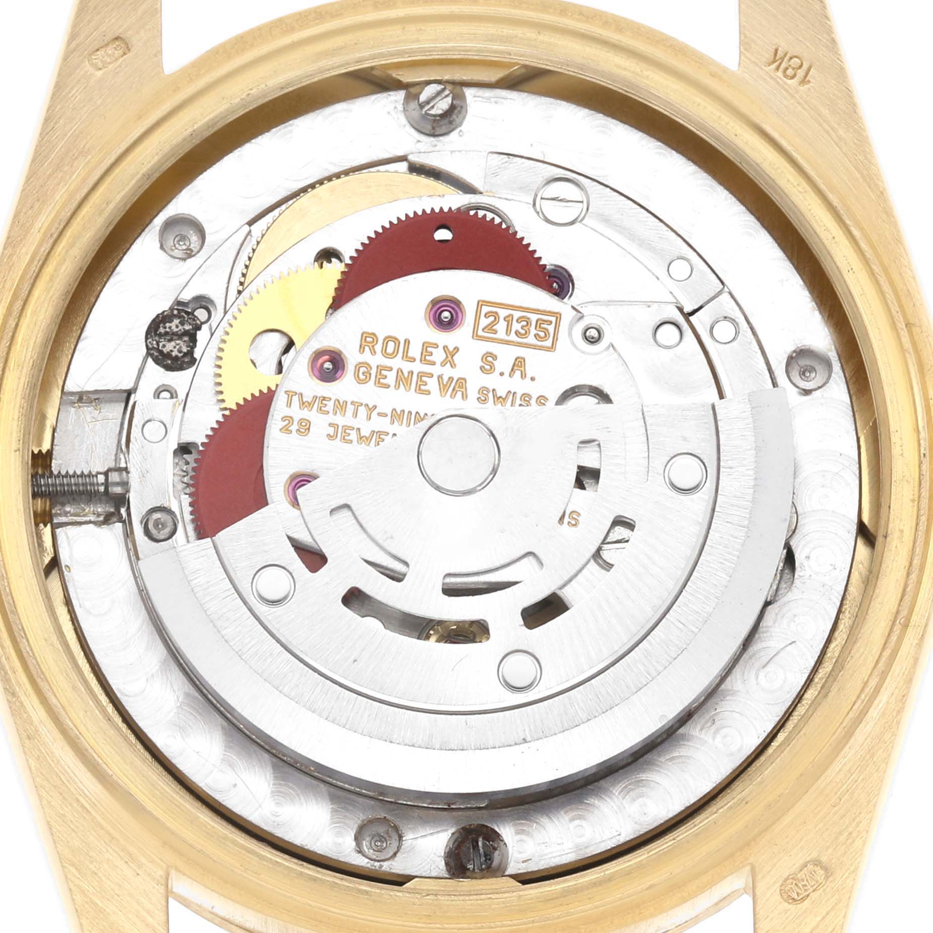 The image shows a close-up of the Rolex President 68278 Women
s Yellow Gold Blue Dial model’s movement, highlighting gears and the rotor.