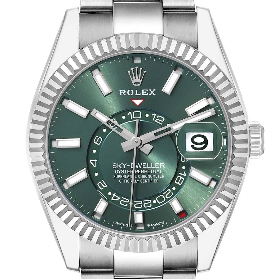 The Rolex Sky-Dweller 336934 Men's Stainless Steel Green Dial watch is shown from a frontal angle, highlighting the green dial, fluted bezel, and date window.