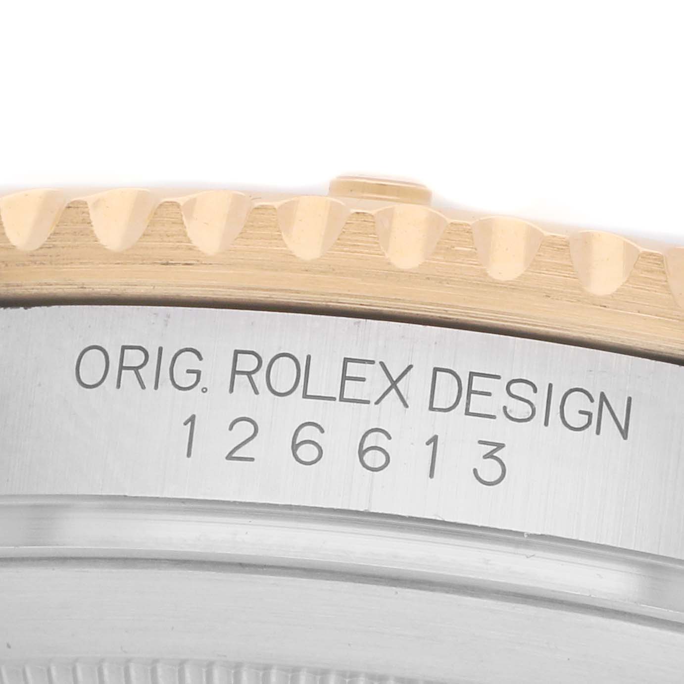 The image shows a close-up side view of the Rolex Submariner 126613 Men
s Steel and Gold (two tone) Blue Dial
s case, highlighting the model number and bezel edge.