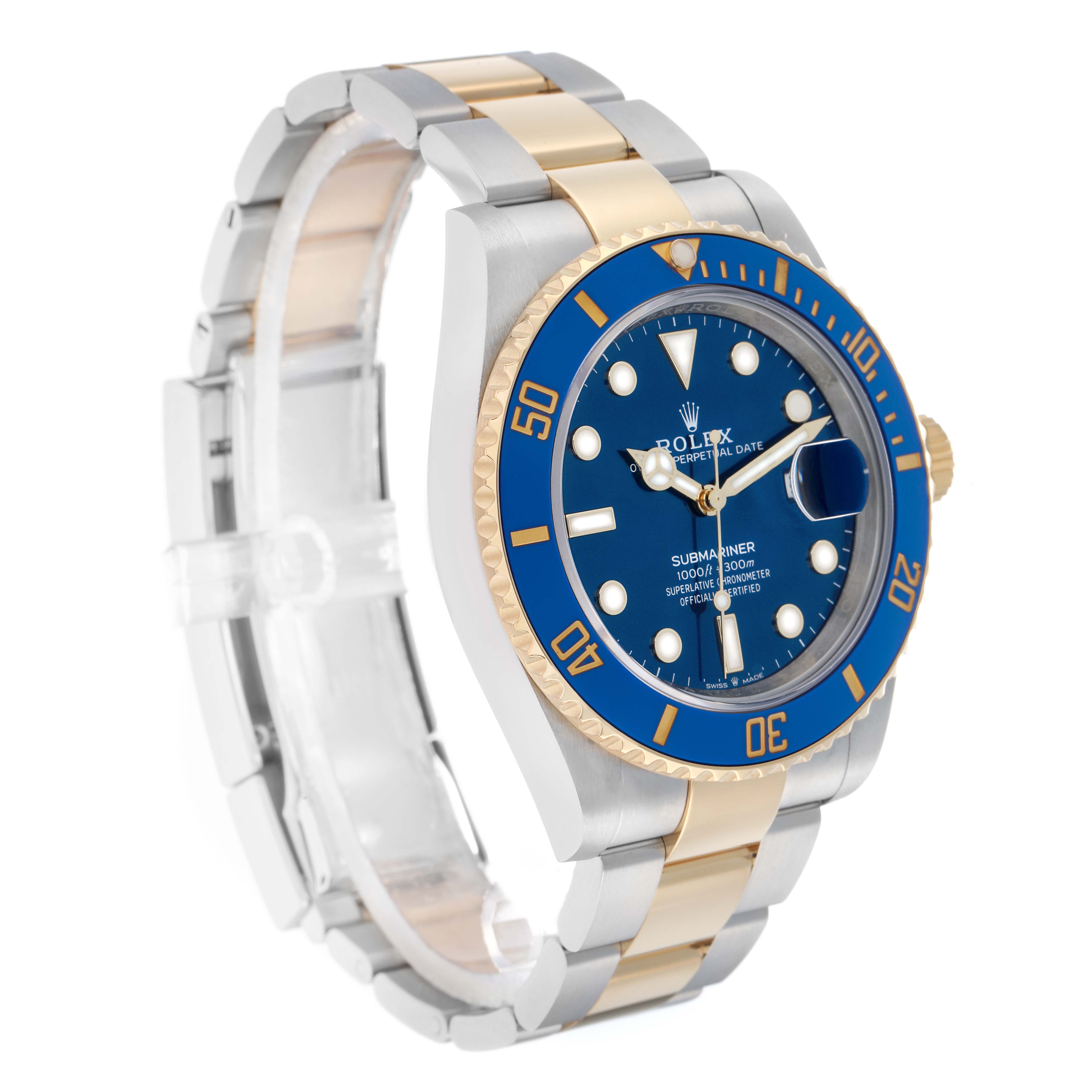 The Rolex Submariner 126613 Men
s Steel and Gold (two tone) Blue Dial is shown from a three-quarter angle, displaying the blue bezel and dial, gold crown, and two-tone bracelet.