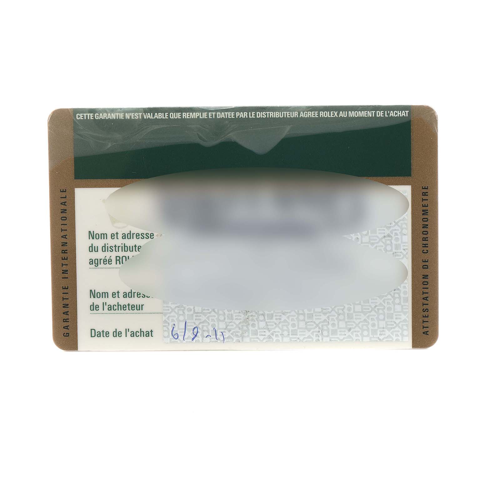 This image shows a close-up of an international guarantee card for a Rolex Submariner 116610LV Men
s Stainless Steel Green Dial watch.