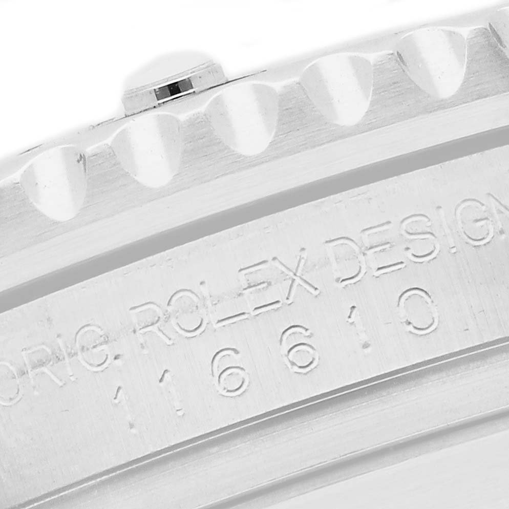 The image shows a close-up of the Rolex Submariner 116610LV Men
s Stainless Steel Green Dial
s case with engraved model numbers.