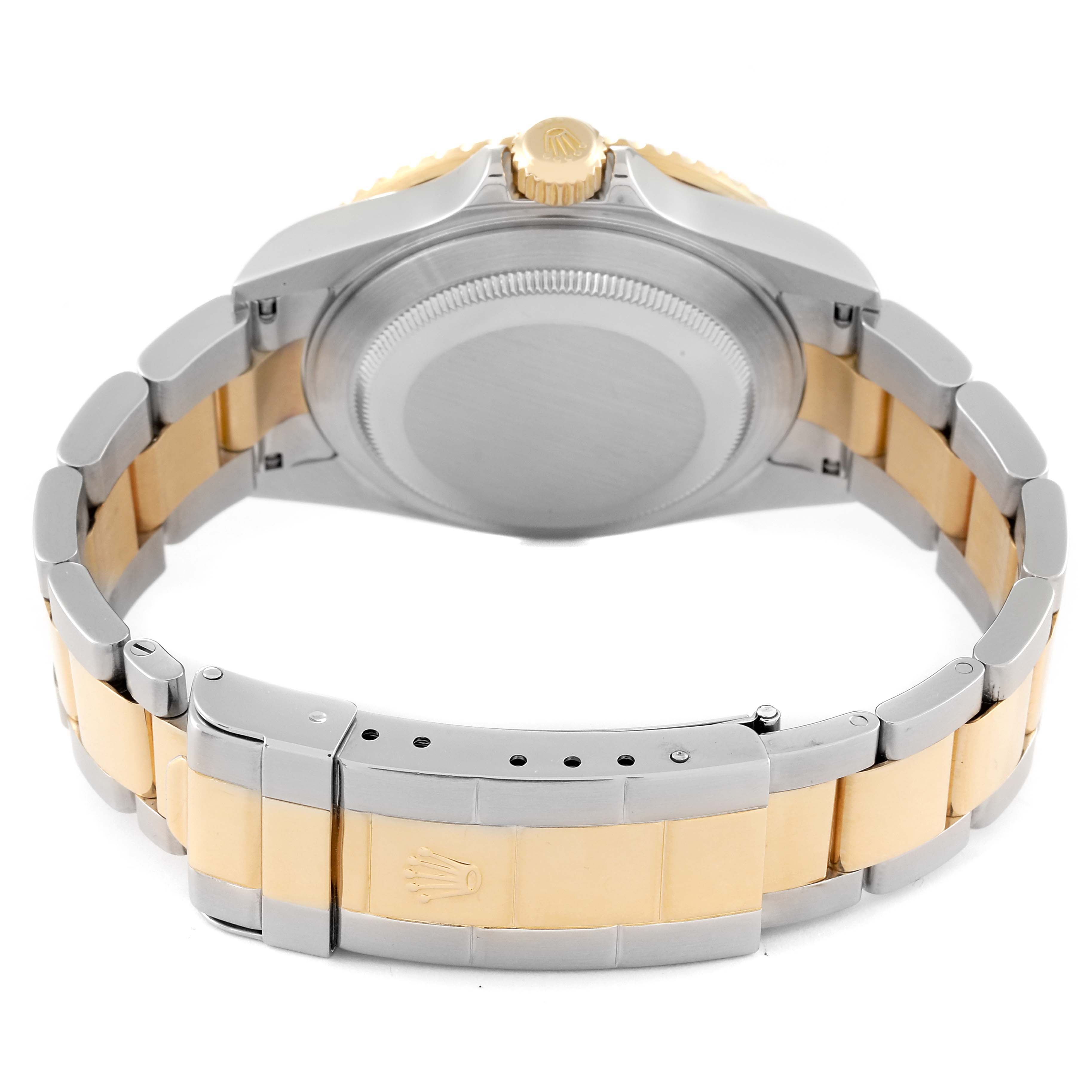 The image shows the back and clasp of a Rolex Submariner 16613 Men's Steel and Gold (two tone) Champagne Dial 16613 Men's Steel and Gold (two tone) Champagne Dial watch, highlighting the two-tone bracelet and crown.