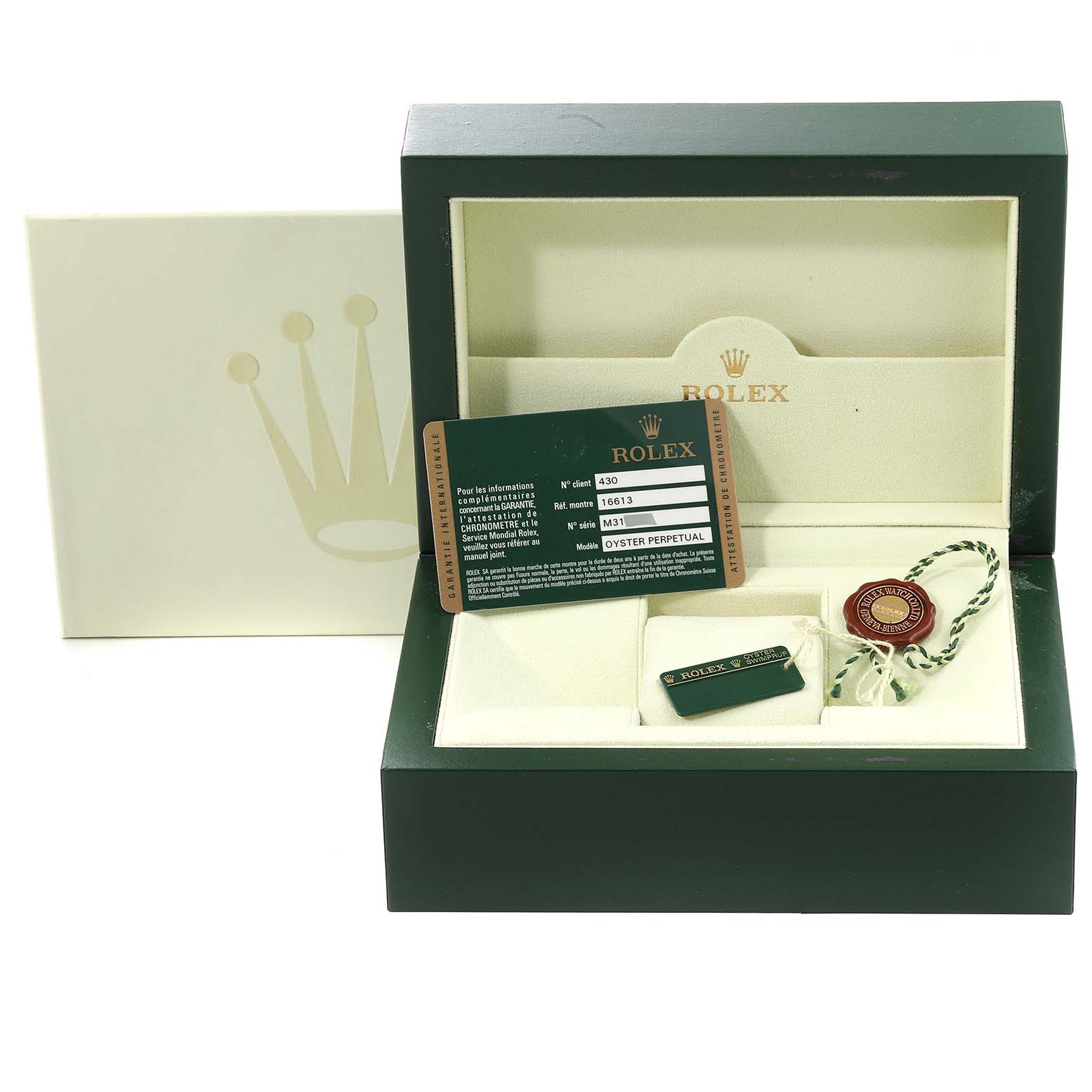 The image shows a green Rolex Submariner 16613 Men's Steel and Gold (two tone) Champagne Dial 16613 Men's Steel and Gold (two tone) Champagne Dial watch box, an ID card, a tag, and a seal, angled from the front.