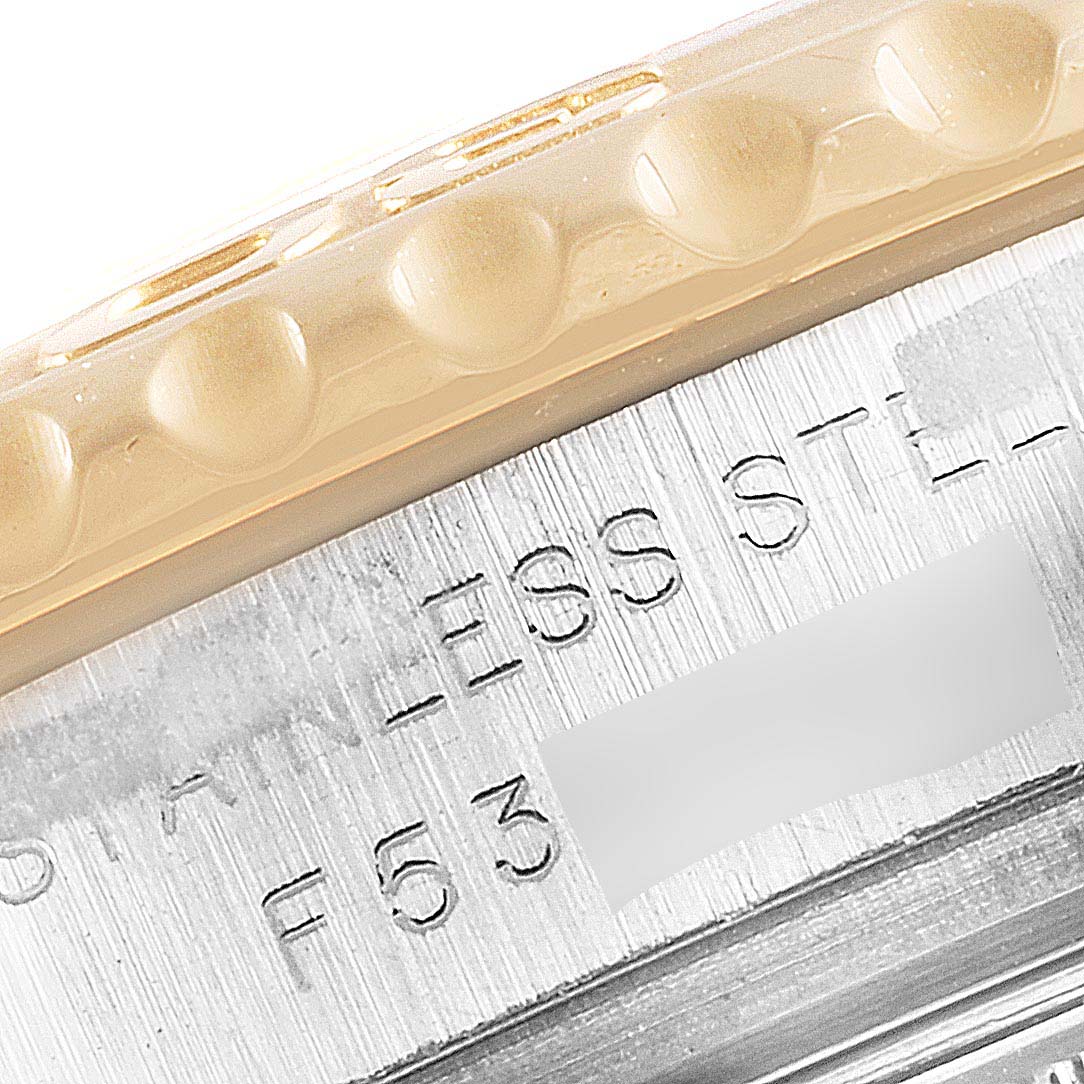 This close-up image shows the engraved bezel and part of the stainless steel casing of a Rolex Yacht-Master 169623 Women's Steel and Gold (two tone) White Dial 169623 Women's Steel and Gold (two tone) White Dial watch.