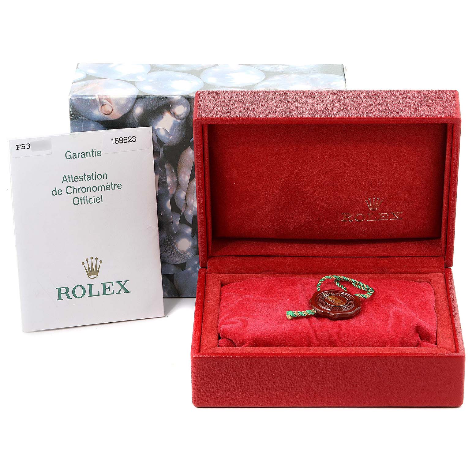 The image shows a Rolex Yacht-Master 169623 Women's Steel and Gold (two tone) White Dial 169623 Women's Steel and Gold (two tone) White Dial watch box, certification document, and seal, viewed from the front.