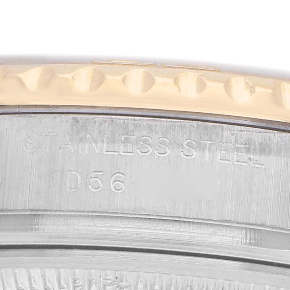 The image shows a close-up of the edge and case back of a Rolex Yacht-Master 169623 Women
s Steel and Gold (two tone) White Dial, highlighting the engraving on the stainless steel.