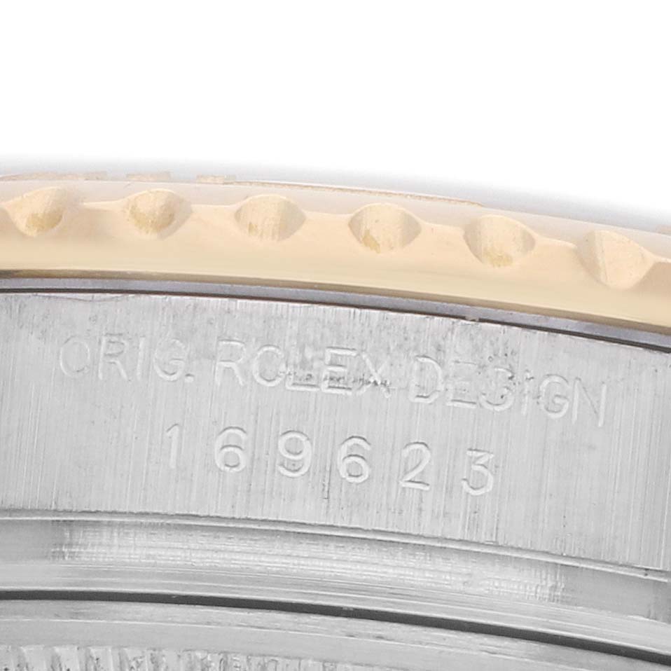The image shows a close-up of the Rolex Yacht-Master 169623 Women
s Steel and Gold (two tone) White Dial
s case side, highlighting the engraved model number.