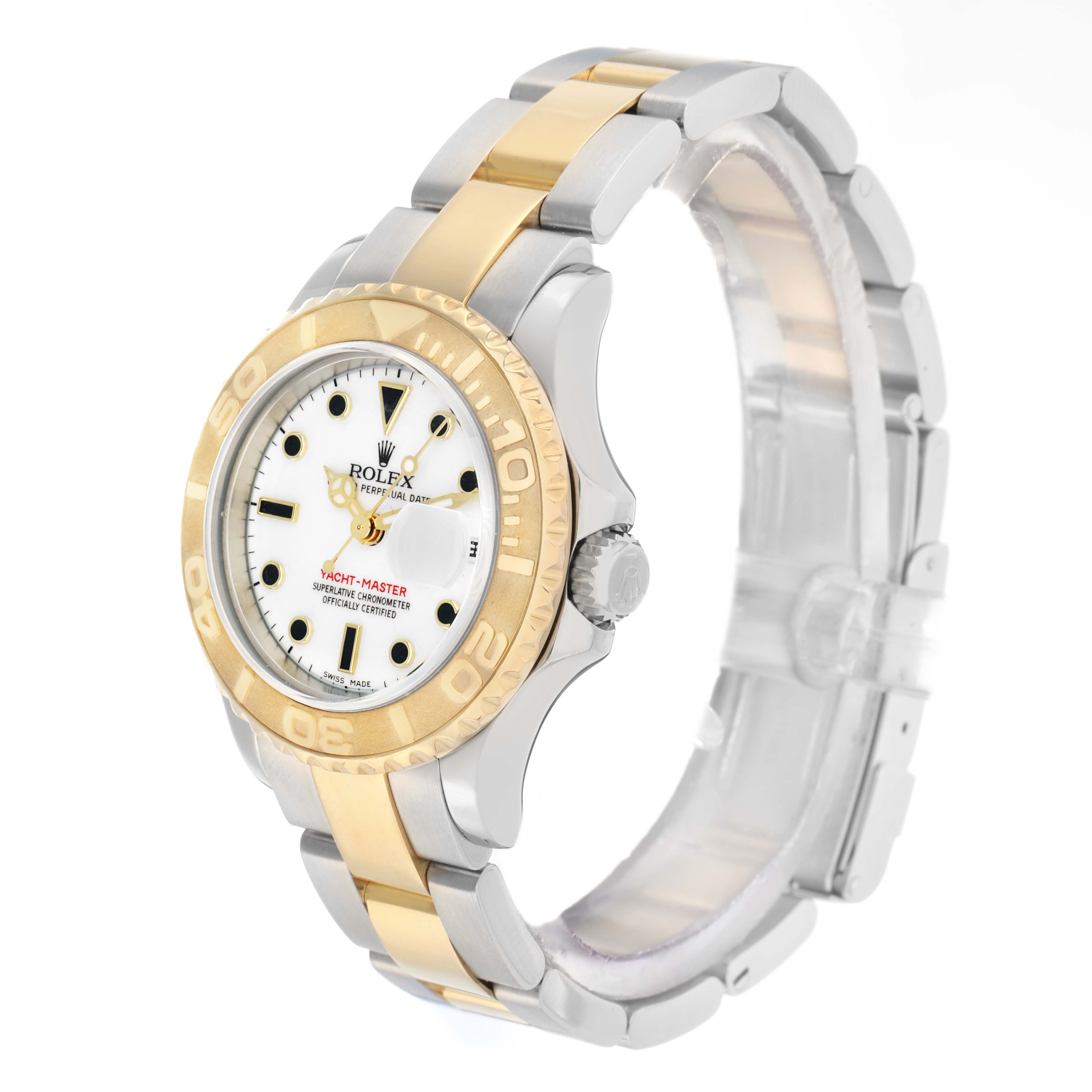 The Rolex Yacht-Master 169623 Women
s Steel and Gold (two tone) White Dial watch is shown at a three-quarter angle, displaying the dial, bezel, case, and bracelet.