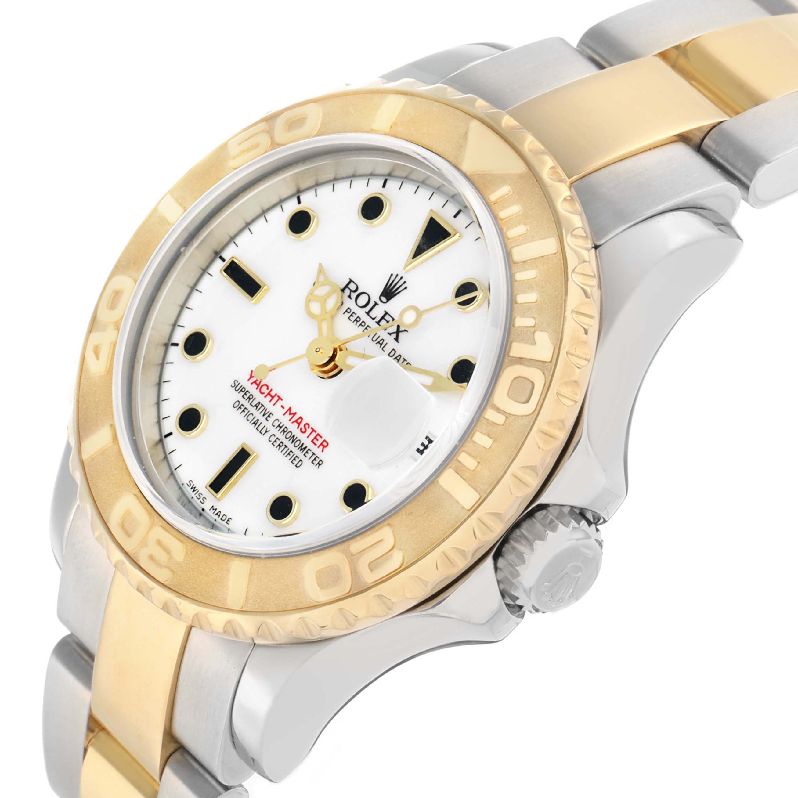 The Rolex Yacht-Master 169623 Women
s Steel and Gold (two tone) White Dial watch is shown at a slight angle, highlighting its bezel, dial, crown, and two-tone bracelet.
