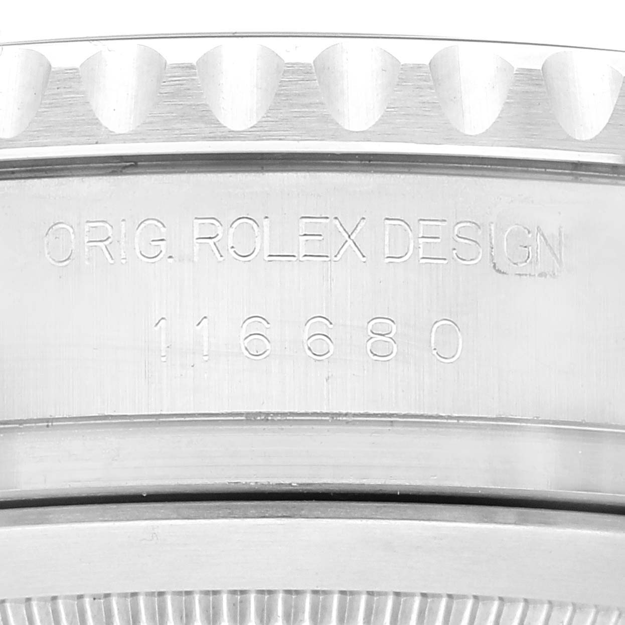 This image shows a close-up of the engraved side of a Rolex Yacht-Master 116680 Men's Stainless Steel White Dial 116680 Men's Stainless Steel White Dial watch casing, displaying "ORIG. ROLEX DESIGN 116680".