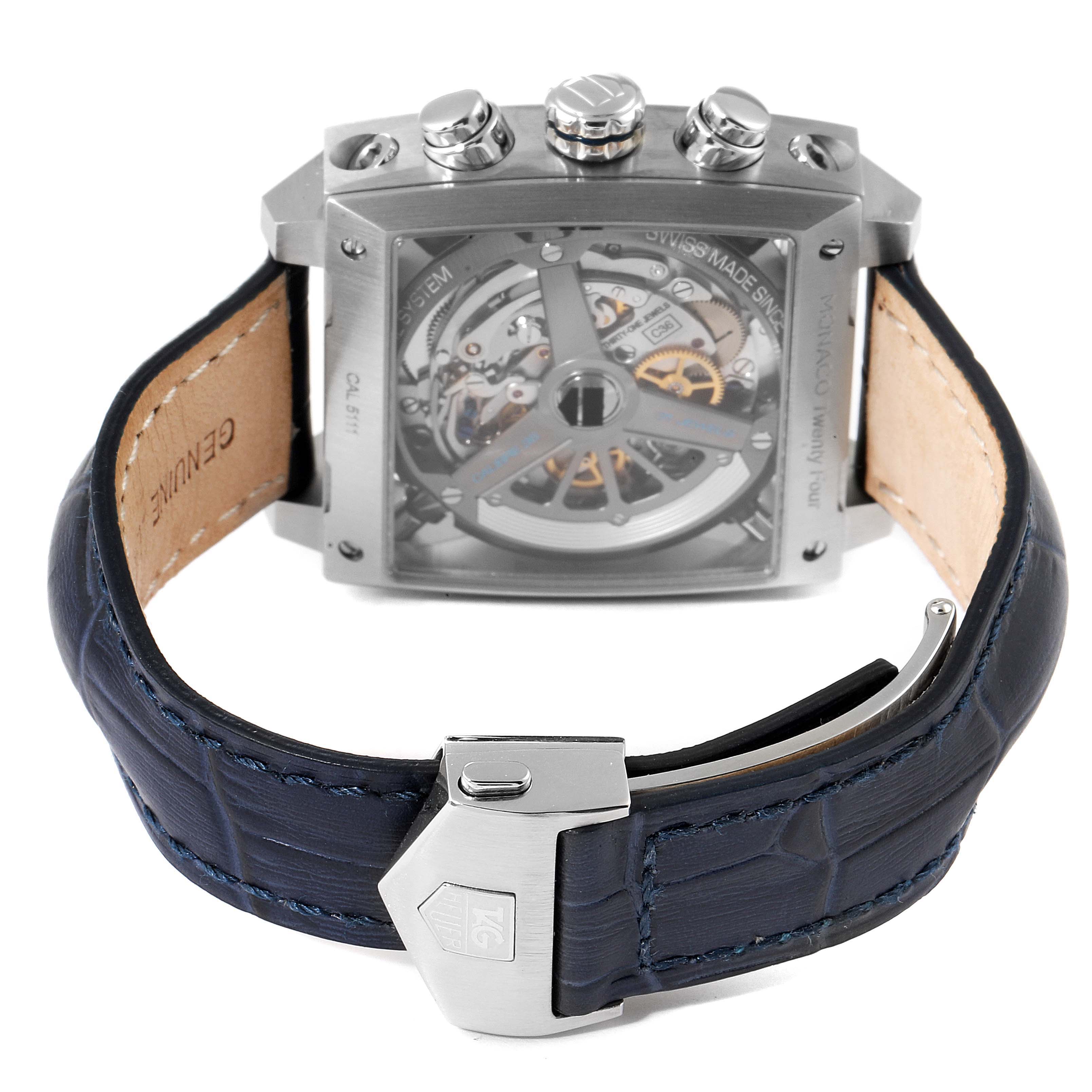 The image shows a rear view of the Tag Heuer Monaco CAL5111.FC6299 Men's Stainless Steel Blue Dial CAL5111.FC6299 Men's Stainless Steel Blue Dial watch, highlighting its transparent case back and leather strap.