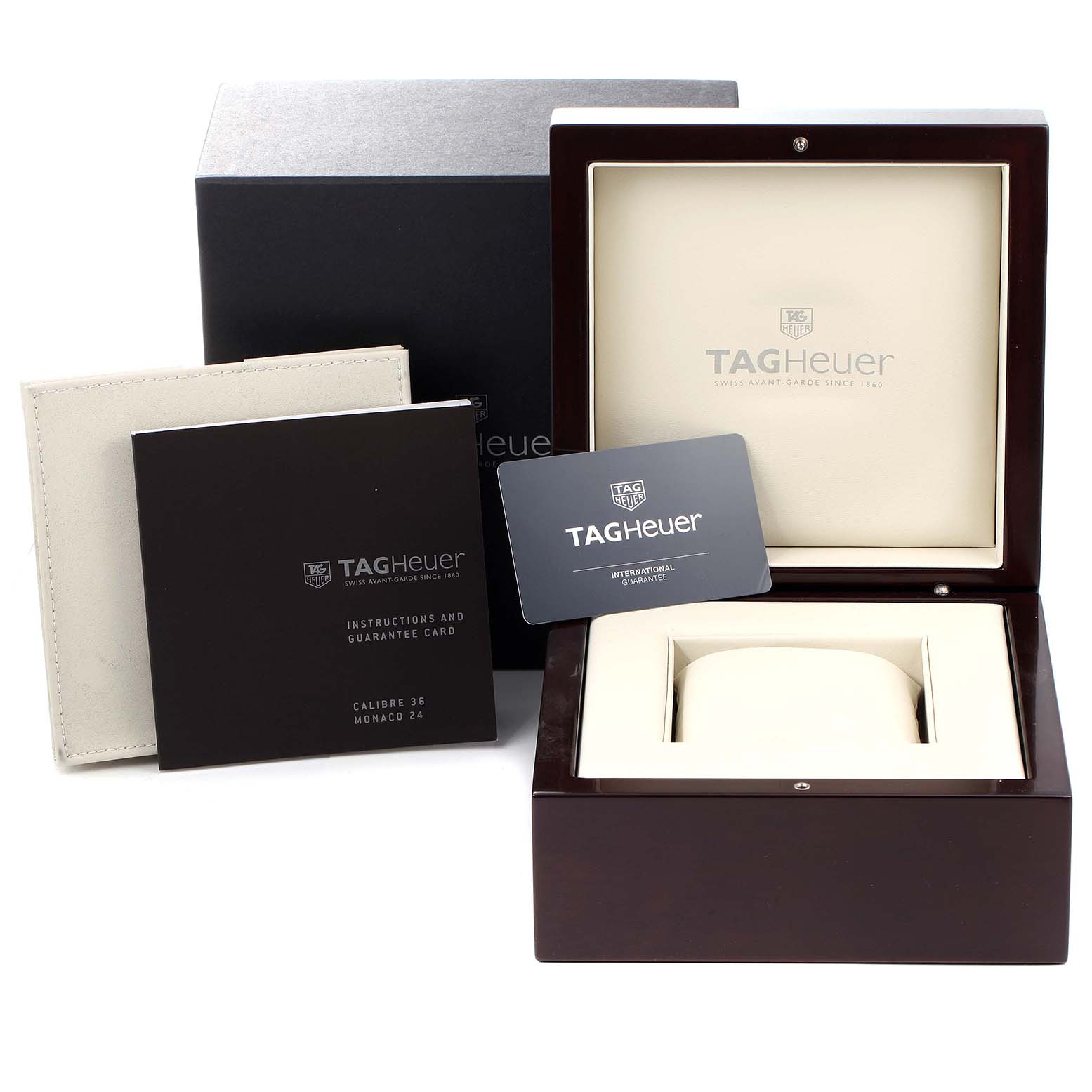 The image shows the Tag Heuer Monaco CAL5111.FC6299 Men's Stainless Steel Blue Dial CAL5111.FC6299 Men's Stainless Steel Blue Dial watch box, instruction manual, guarantee card, and outer packaging from a front angle.