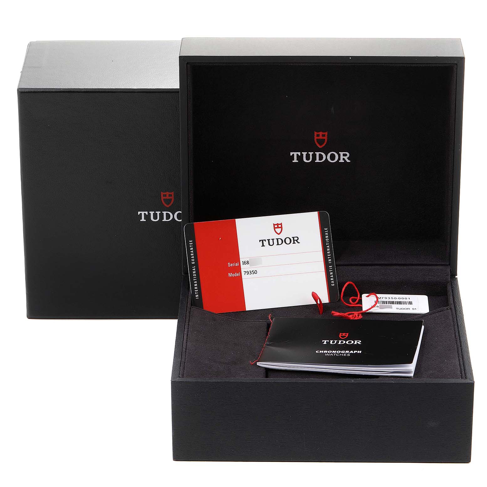 The image shows the packaging and accessories for a Tudor Heritage Black Bay 79350 Men
s Stainless Steel Black Dial 79350 Men
s Stainless Steel Black Dial watch, including the box, warranty card, and booklet.