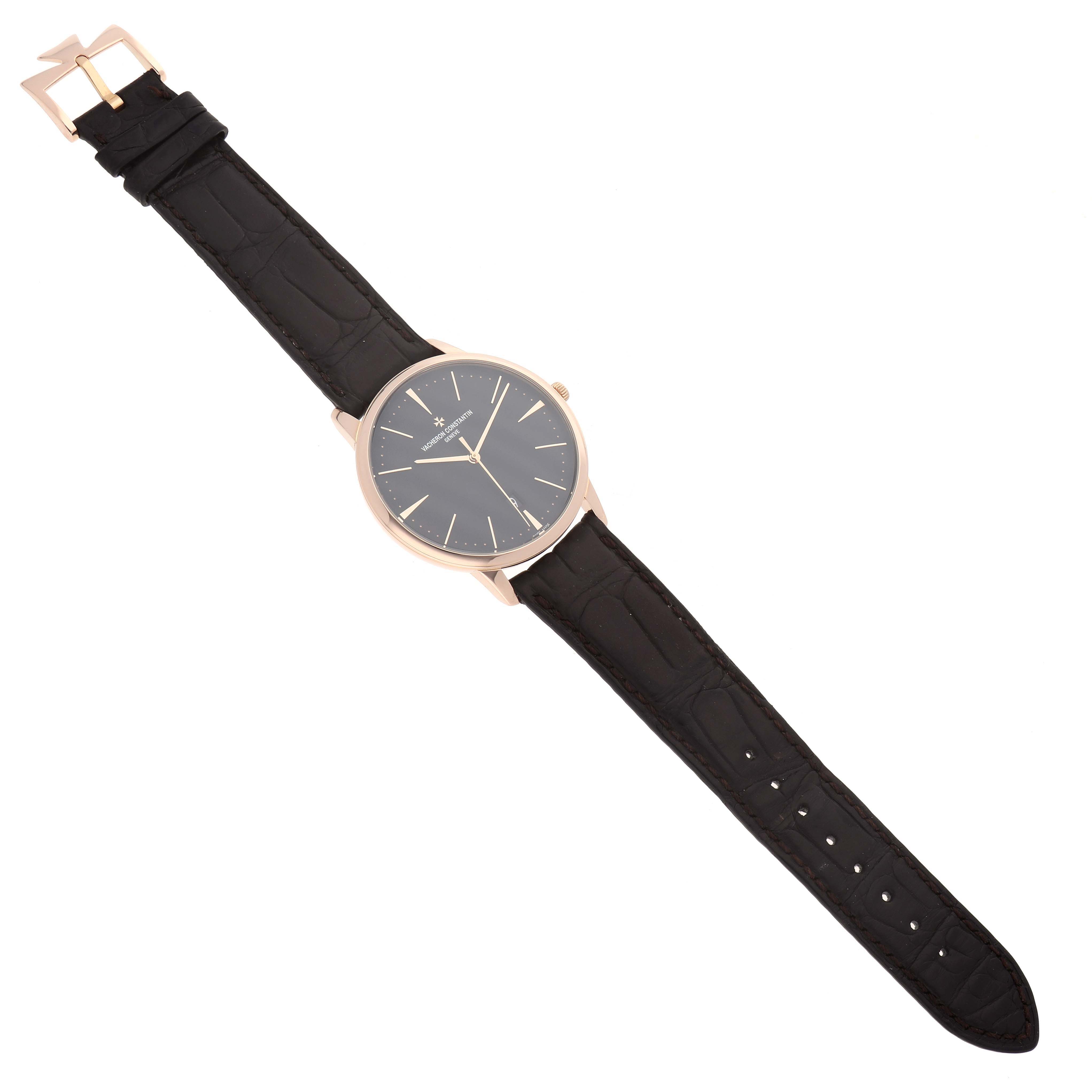 The Vacheron Constantin Patrimony 85180 Men
s Rose Gold Black Dial watch is shown from a top-down angle, displaying the full face, strap, and clasp.