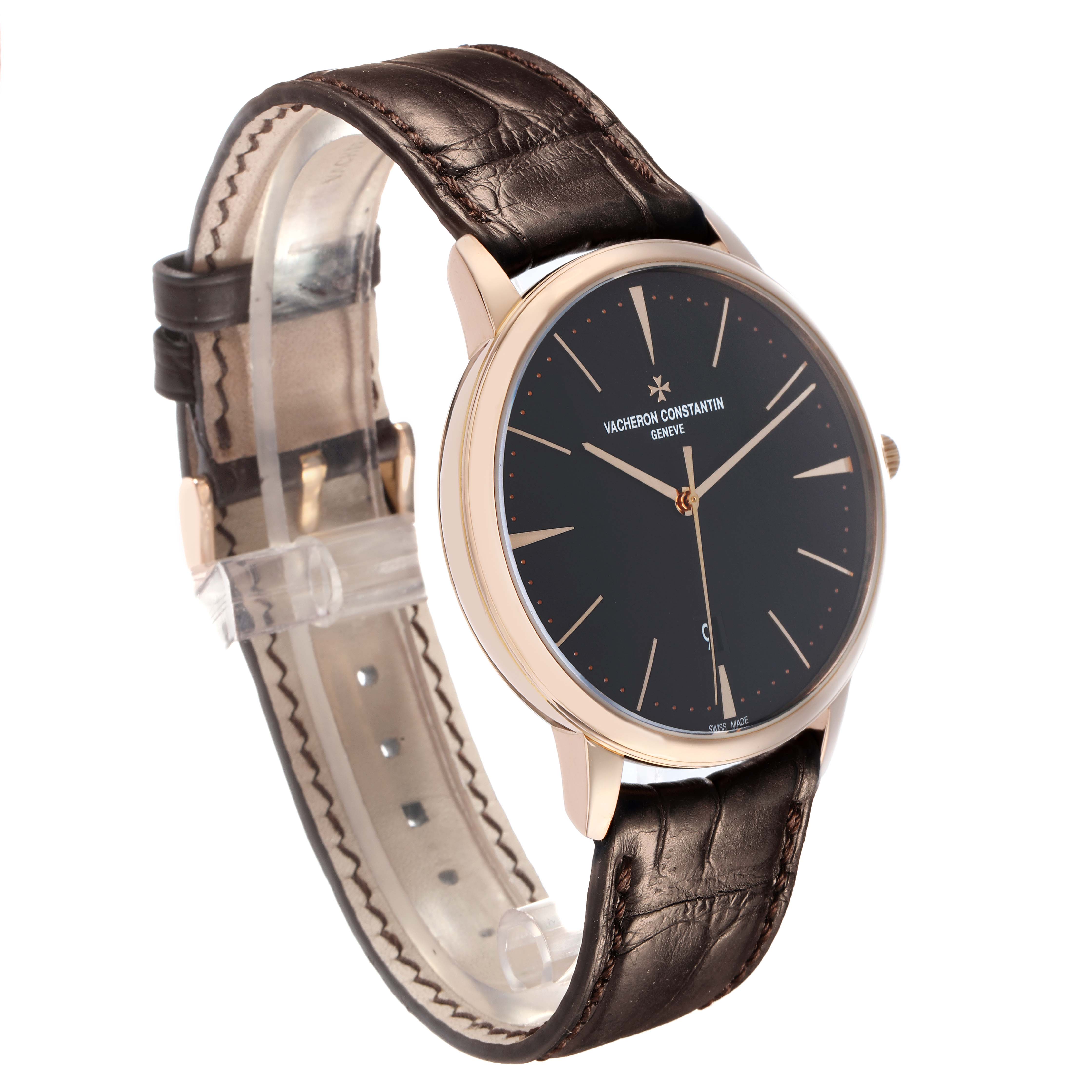 The Vacheron Constantin Patrimony 85180 Men
s Rose Gold Black Dial watch is shown at a three-quarter angle, highlighting its dial, case, and leather strap.