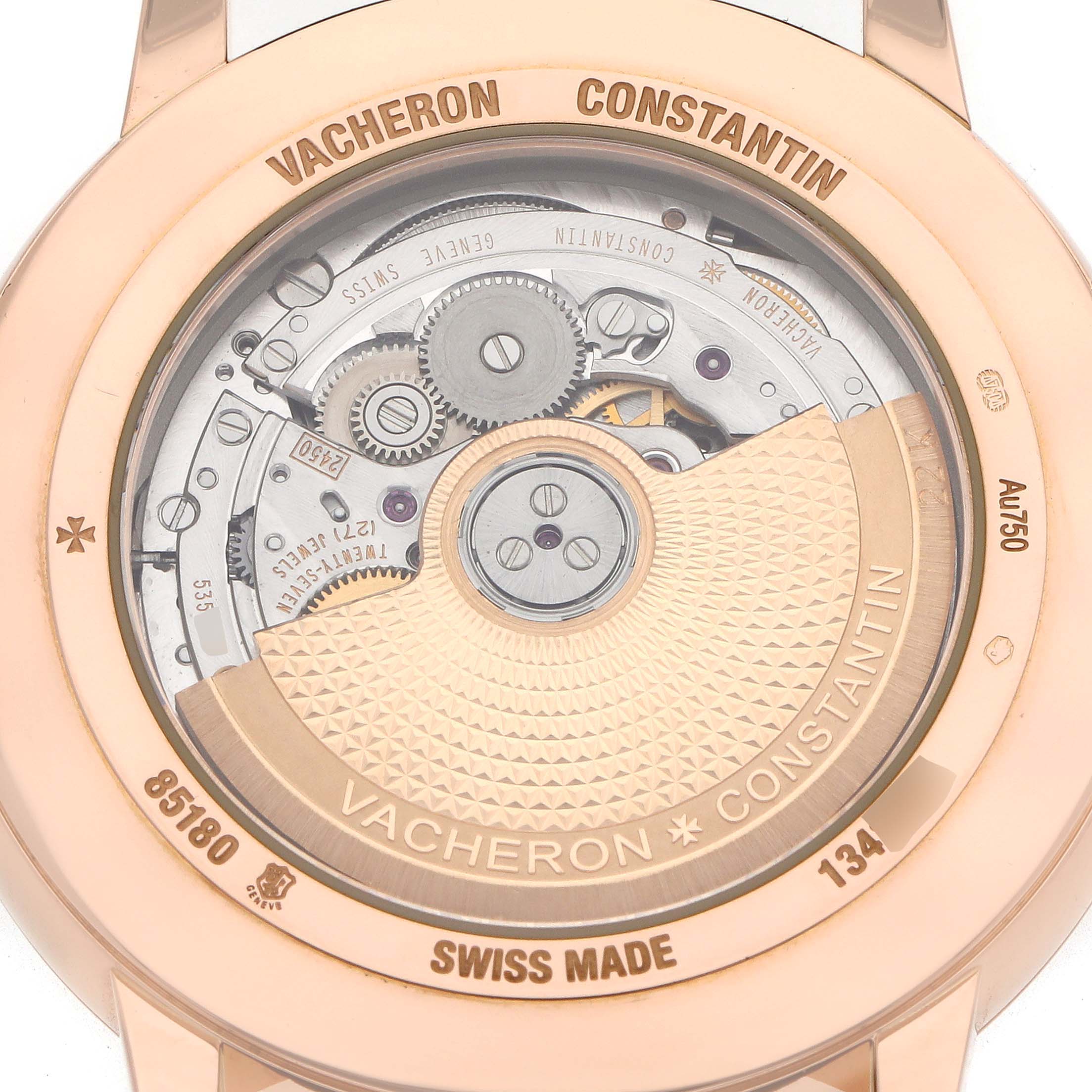 The image shows the back view of a Vacheron Constantin Patrimony 85180 Men
s Rose Gold Black Dial, highlighting the movement and rotor.