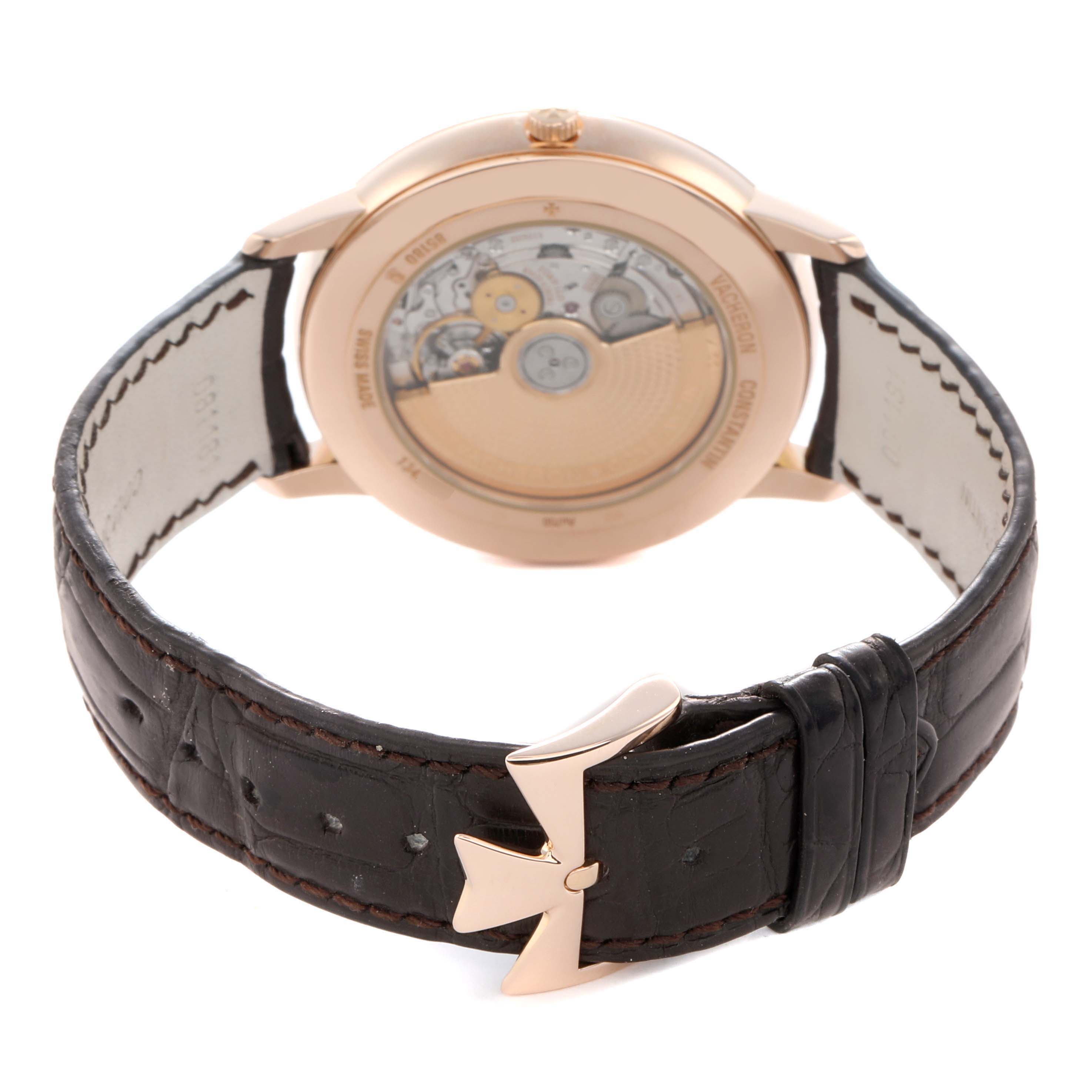 The image shows the back view of a Vacheron Constantin Patrimony 85180 Men
s Rose Gold Black Dial watch displaying its movement and a closed buckle.