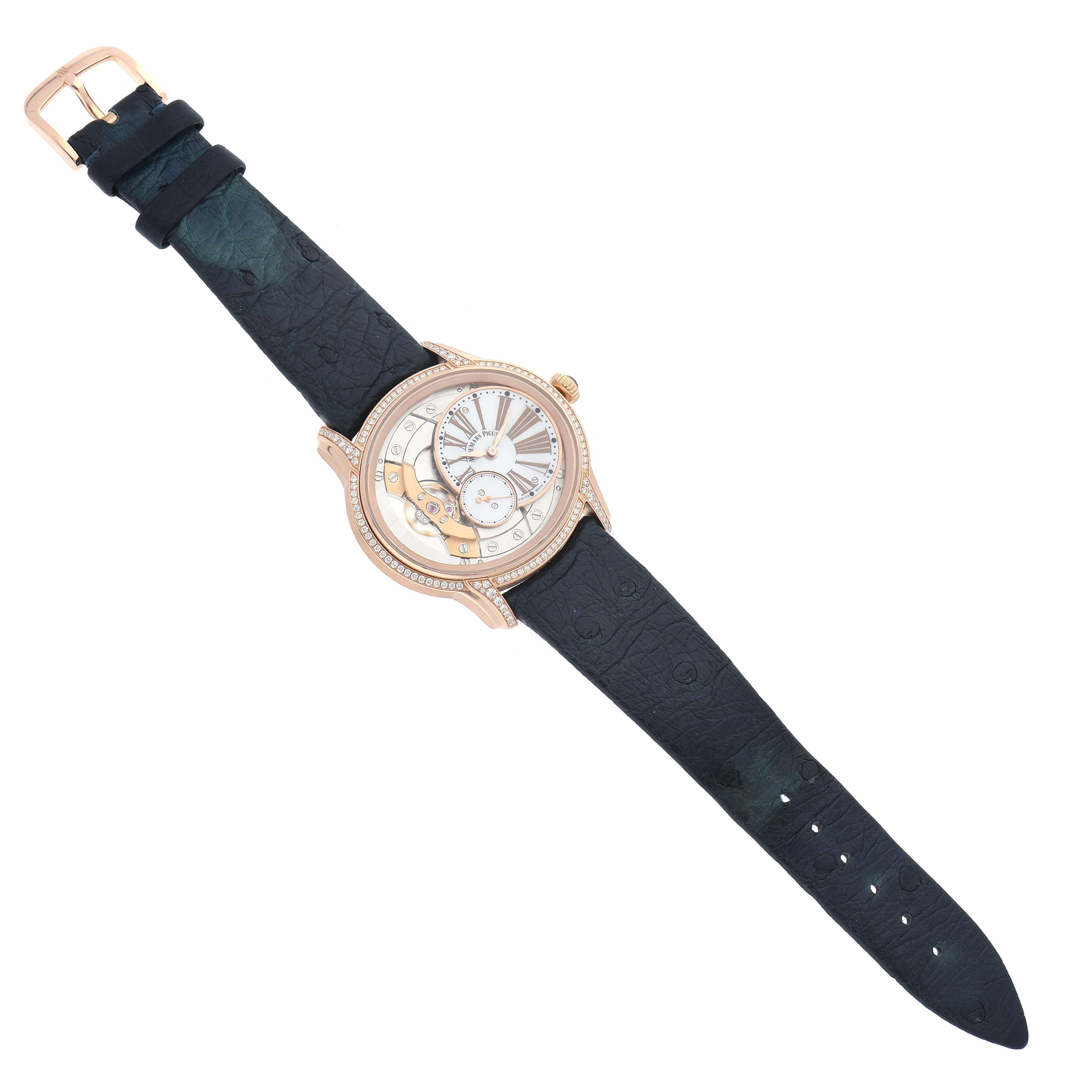 The Audemars Piguet Millenary 77247OR Women
s Rose Gold Mother of Pearl Dial watch is shown from a top view, displaying the face, front of the case, and the full strap.