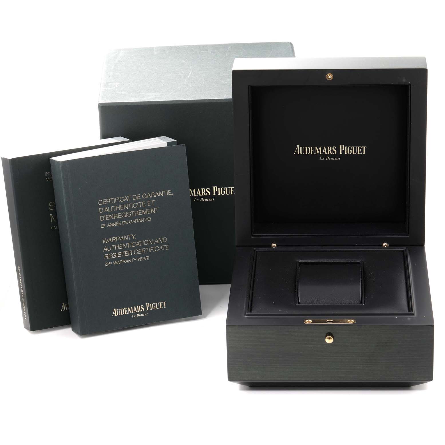 The image shows the packaging and accessories of an Audemars Piguet Royal Oak 15450ST.OO.1256ST.01 Men's Stainless Steel Silver Dial 15450ST.OO.1256ST.01 Men's Stainless Steel Silver Dial, including its box and documentation.