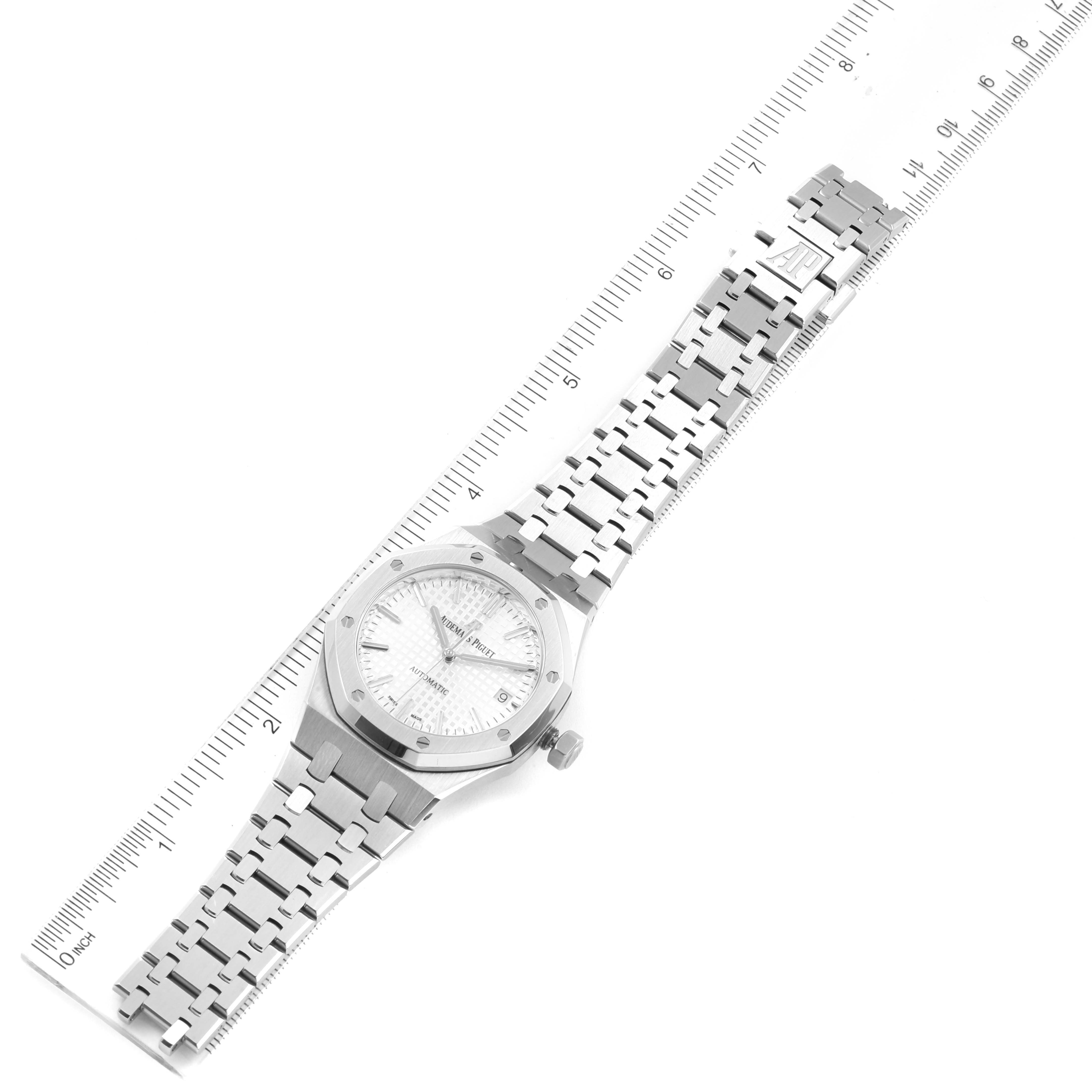 The image shows the front face and bracelet of the Audemars Piguet Royal Oak 15450ST.OO.1256ST.01 Men's Stainless Steel Silver Dial 15450ST.OO.1256ST.01 Men's Stainless Steel Silver Dial watch, placed alongside a ruler for scale.