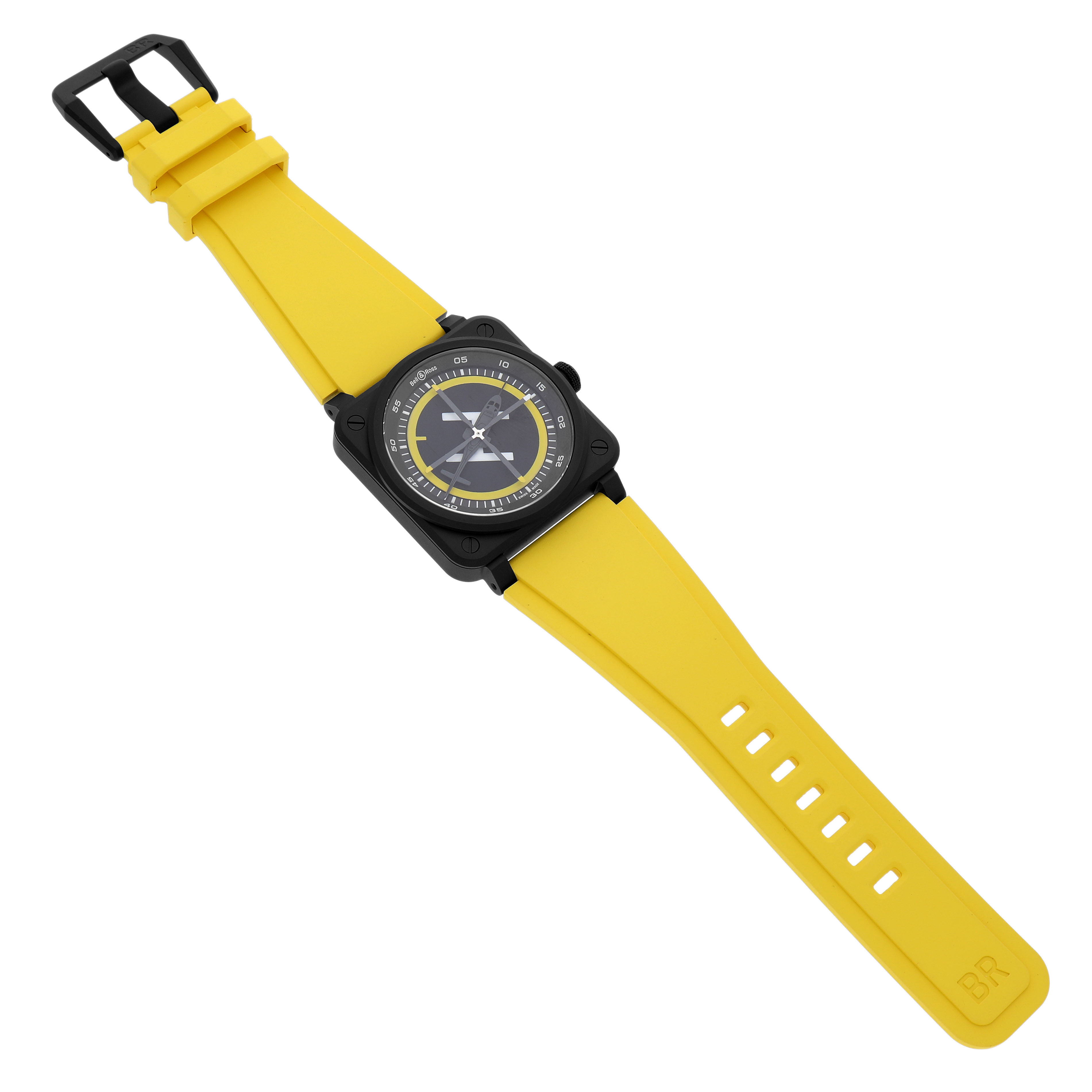The Bell & Ross Instruments BR-03 Men's Ceramic Black Dial model watch is shown at an angled top view, displaying the face and yellow strap clearly.