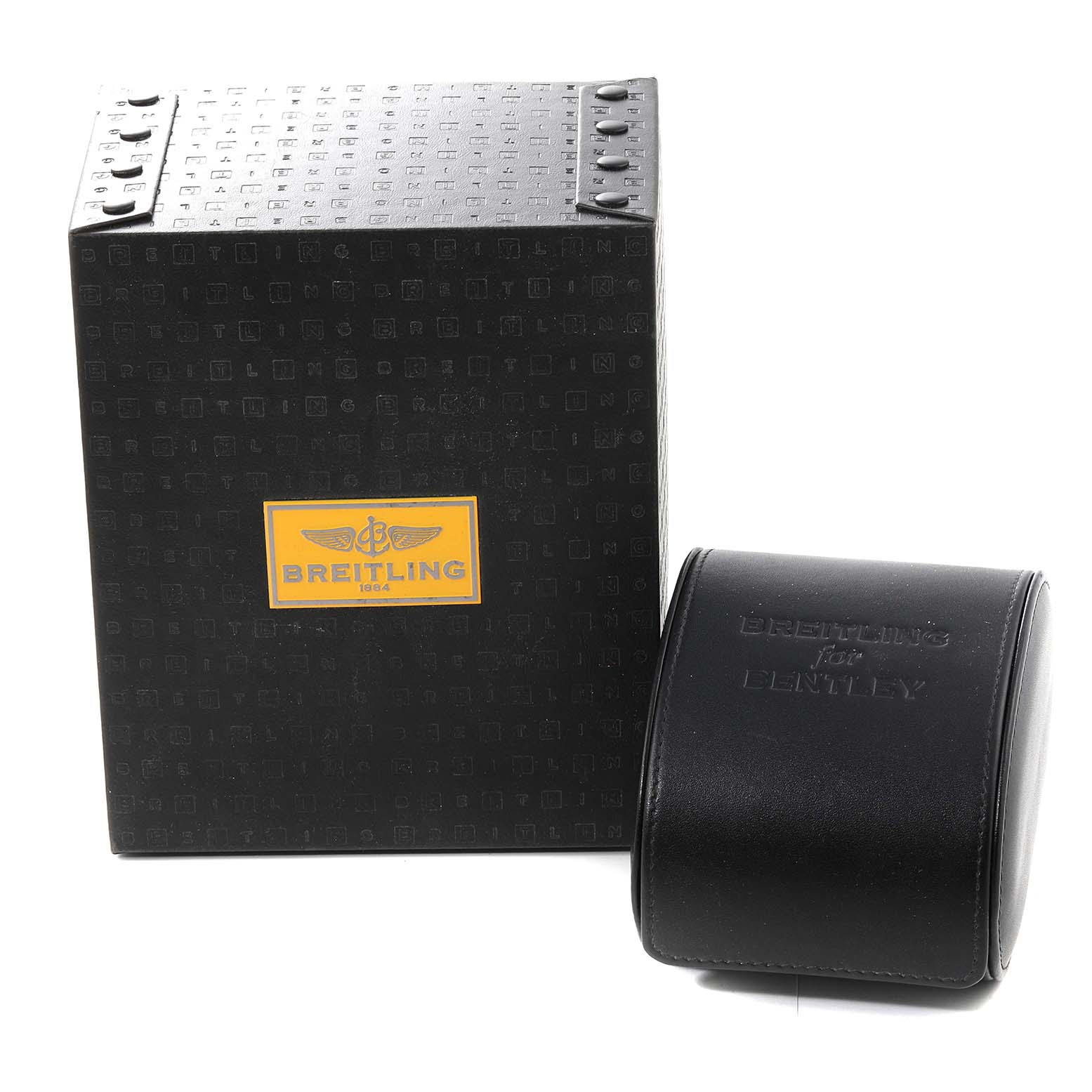 The image shows the packaging for the Breitling Chronomat CB0110 Men's Steel and Gold (two tone) Black Dial CB0110 Men's Steel and Gold (two tone) Black Dial watch, including a black box and a separate black leather case embossed with "Breitling for Bentley."