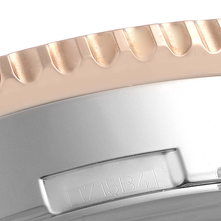 The image shows a close-up of the bezel and case of a Breitling Navitimer UB0127 Men's Steel and Gold (two tone) Black Dial UB0127 Men's Steel and Gold (two tone) Black Dial watch.