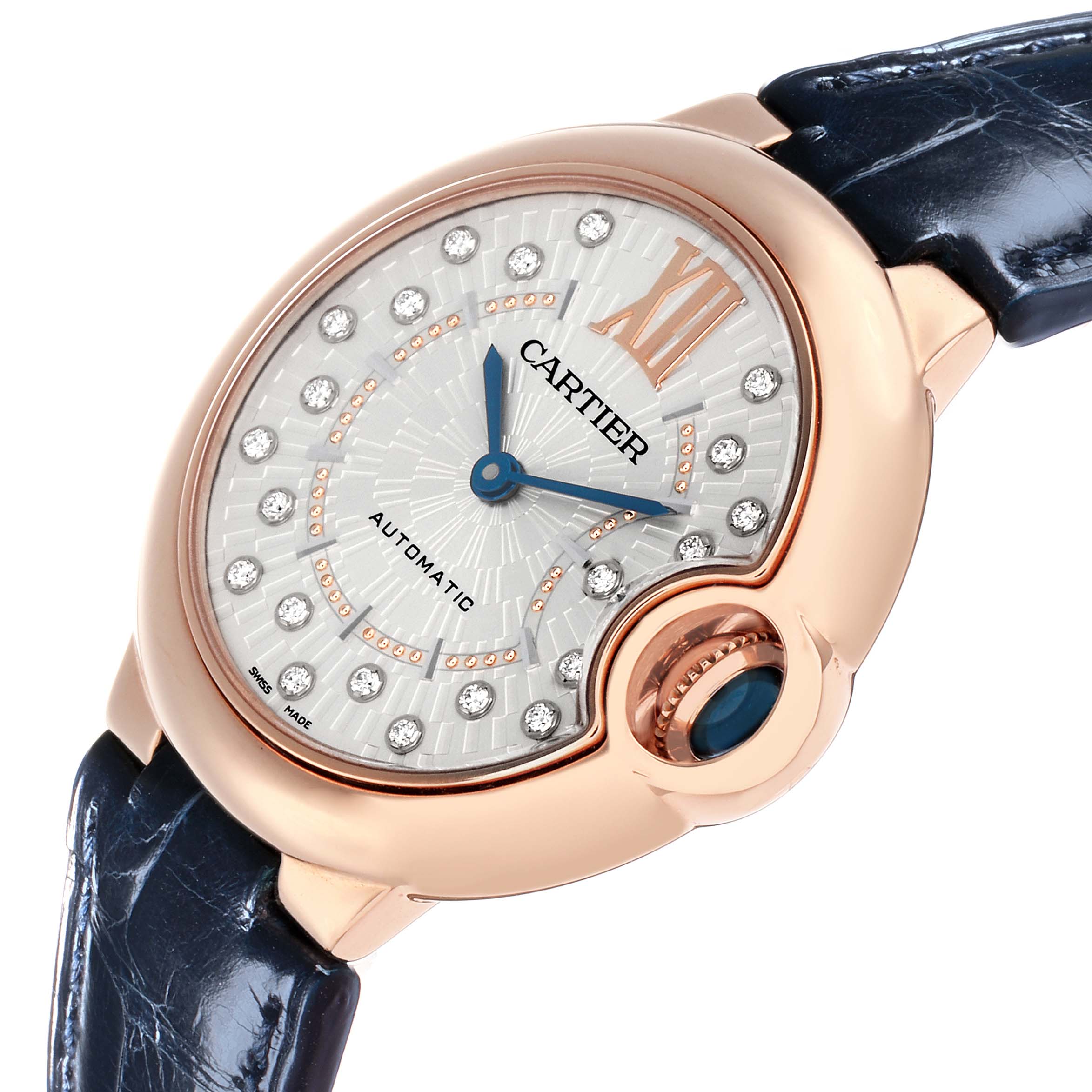 The Ballon Bleu de Cartier watch is shown at an angle highlighting the dial, crown, and part of the strap.