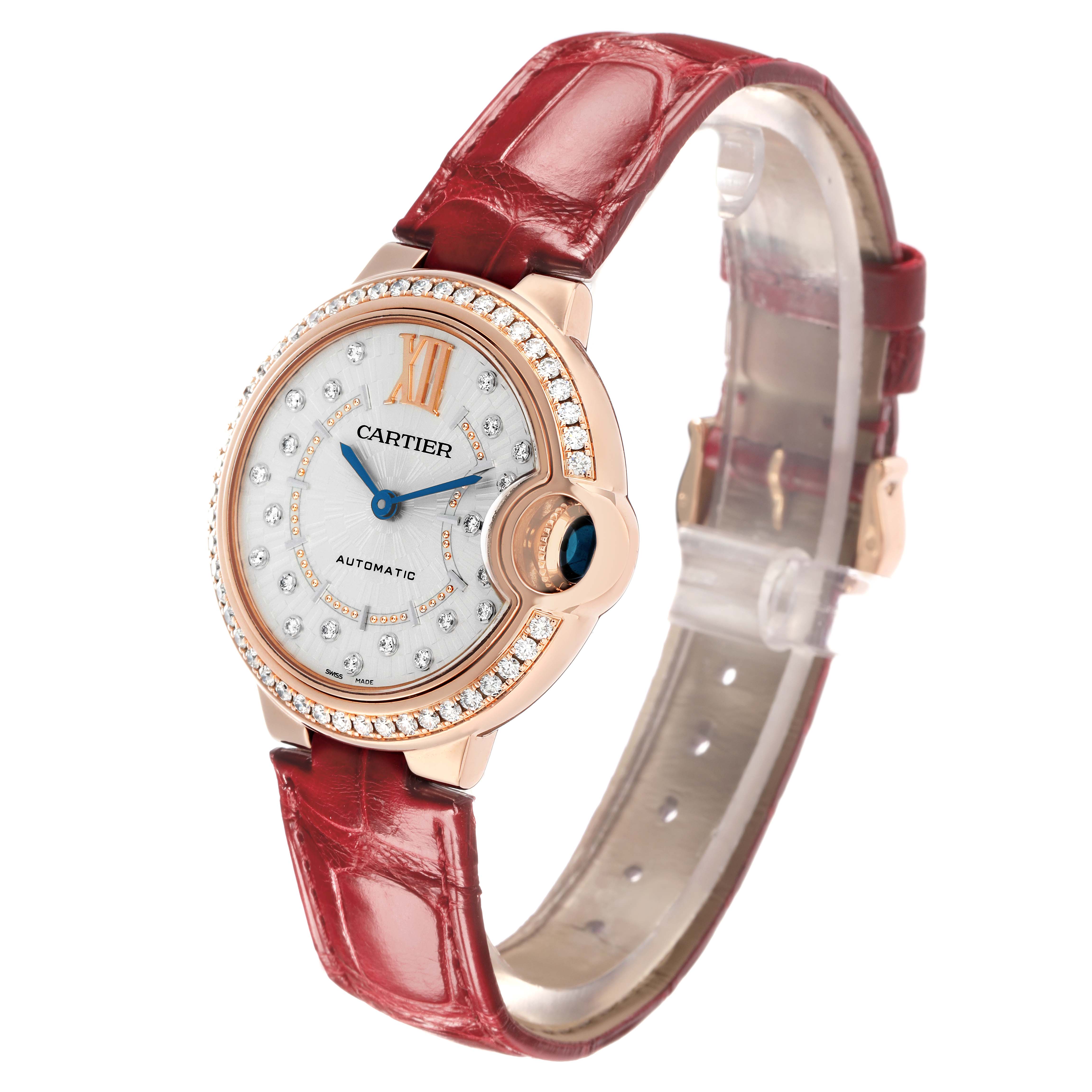 The Cartier Ballon Bleu WJBB0080 Women
s Rose Gold Silver Dial watch is shown at a slight angle, highlighting the face, bezel, and red leather strap.