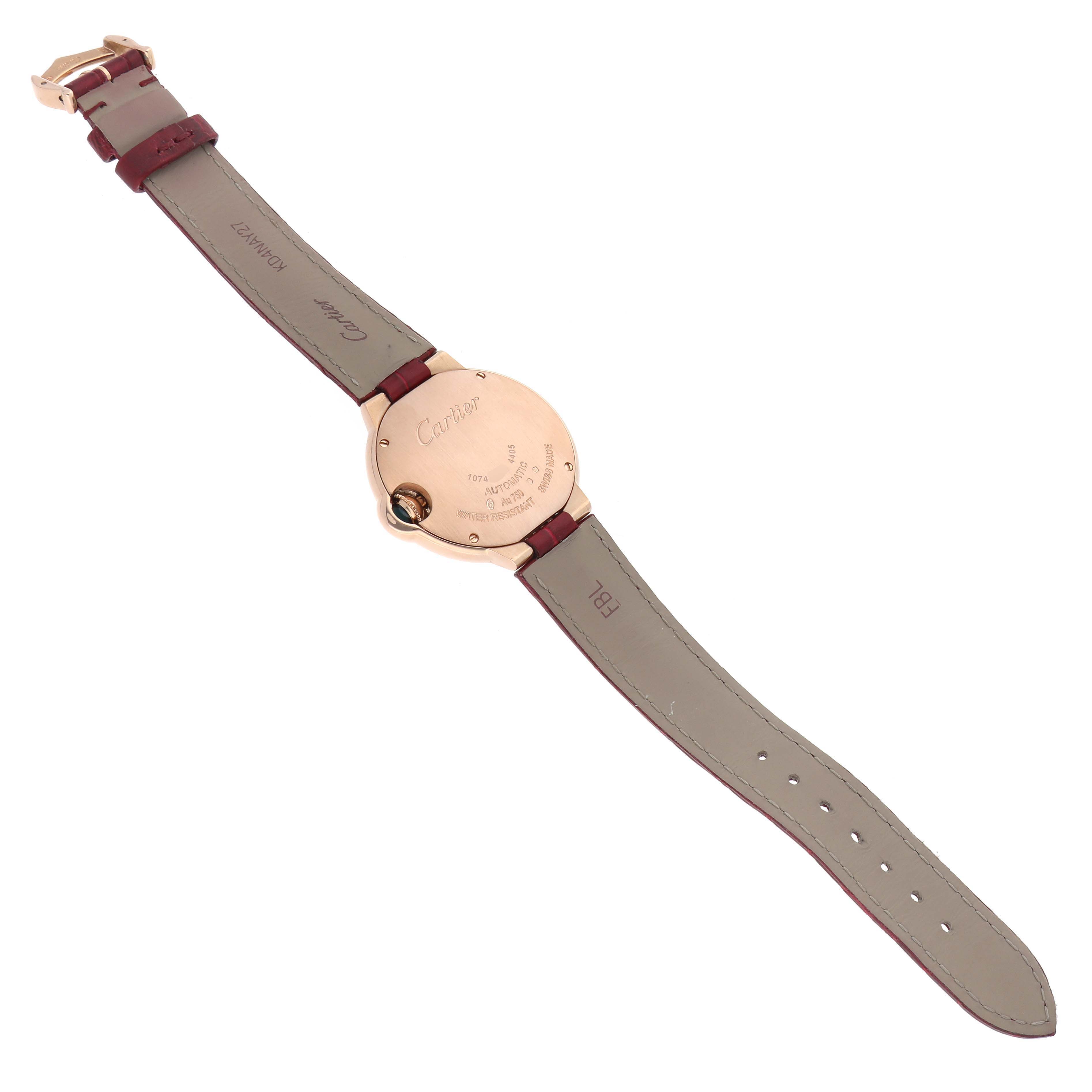 The Cartier Ballon Bleu WJBB0080 Women
s Rose Gold Silver Dial watch is shown from the back, displaying the case back and full leather strap with the brand engraved.