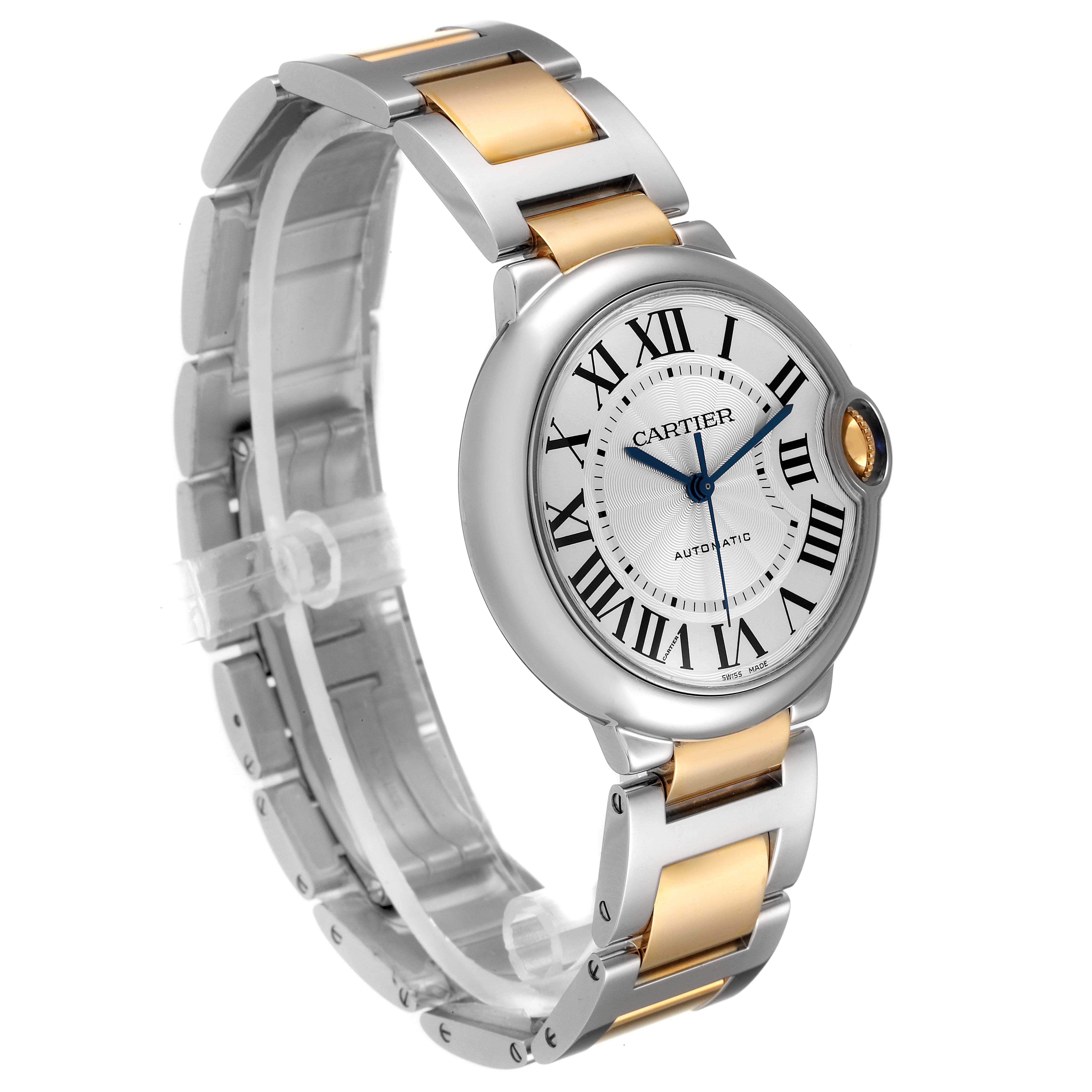 The image shows a side angle of the Cartier Ballon Bleu W2BB0012 Men
s Steel and Gold (two tone) Silver Dial W2BB0012 Men
s Steel and Gold (two tone) Silver Dial watch, highlighting its two-tone bracelet, dial, and crown.
