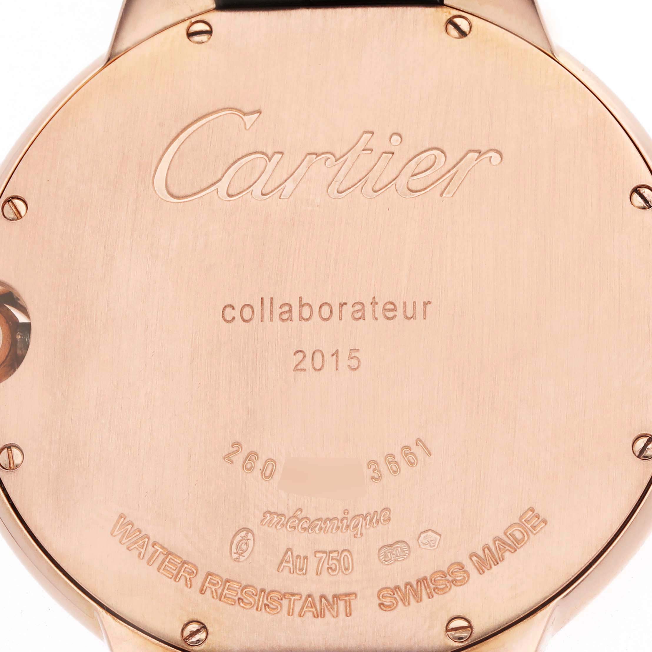The image shows the back case of a Cartier Ballon Bleu W6920089 Men
s Rose Gold Grey Dial watch, featuring engravings and screws.