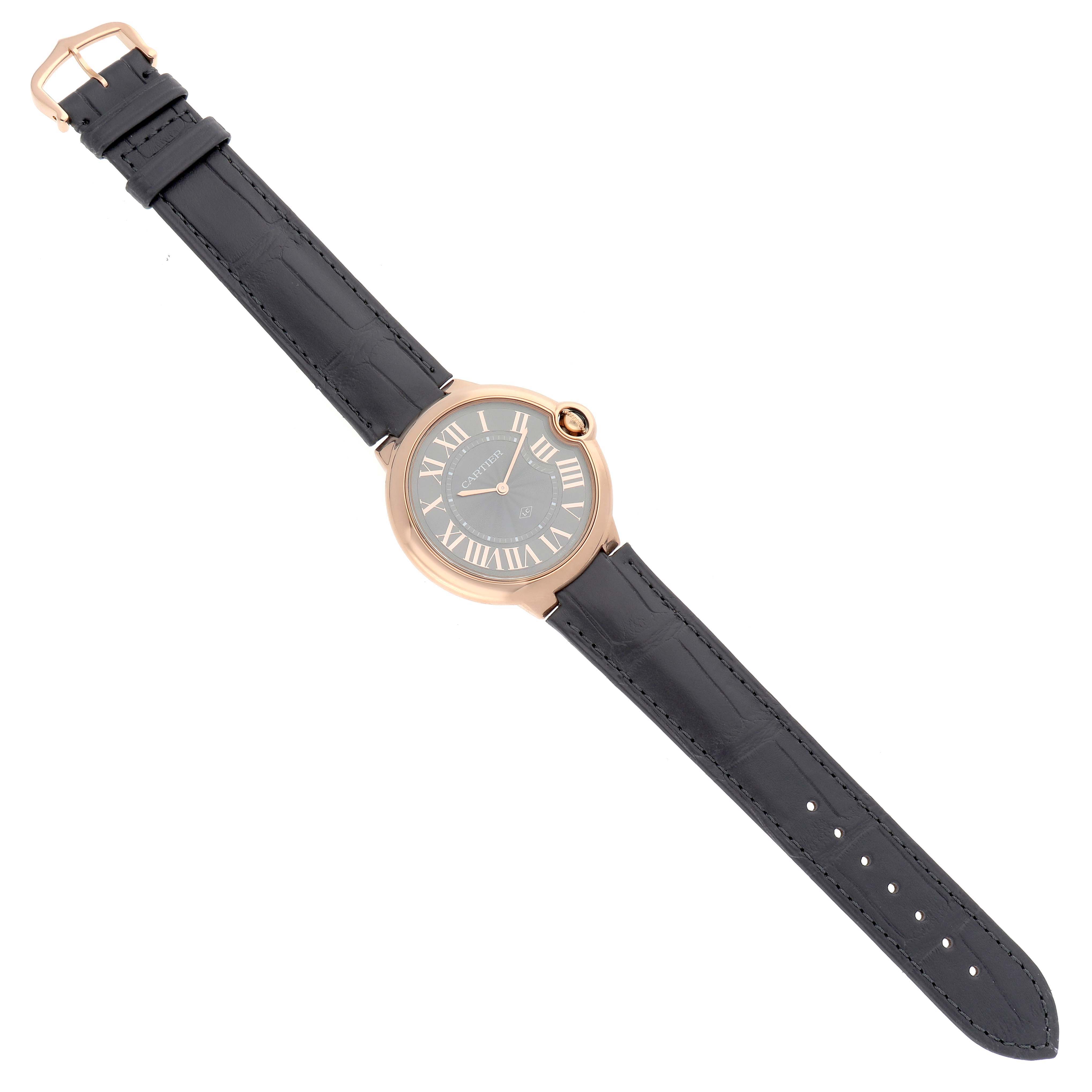 The Cartier Ballon Bleu W6920089 Men
s Rose Gold Grey Dial watch is shown from a top-down angle, displaying the full strap and face with Roman numerals.