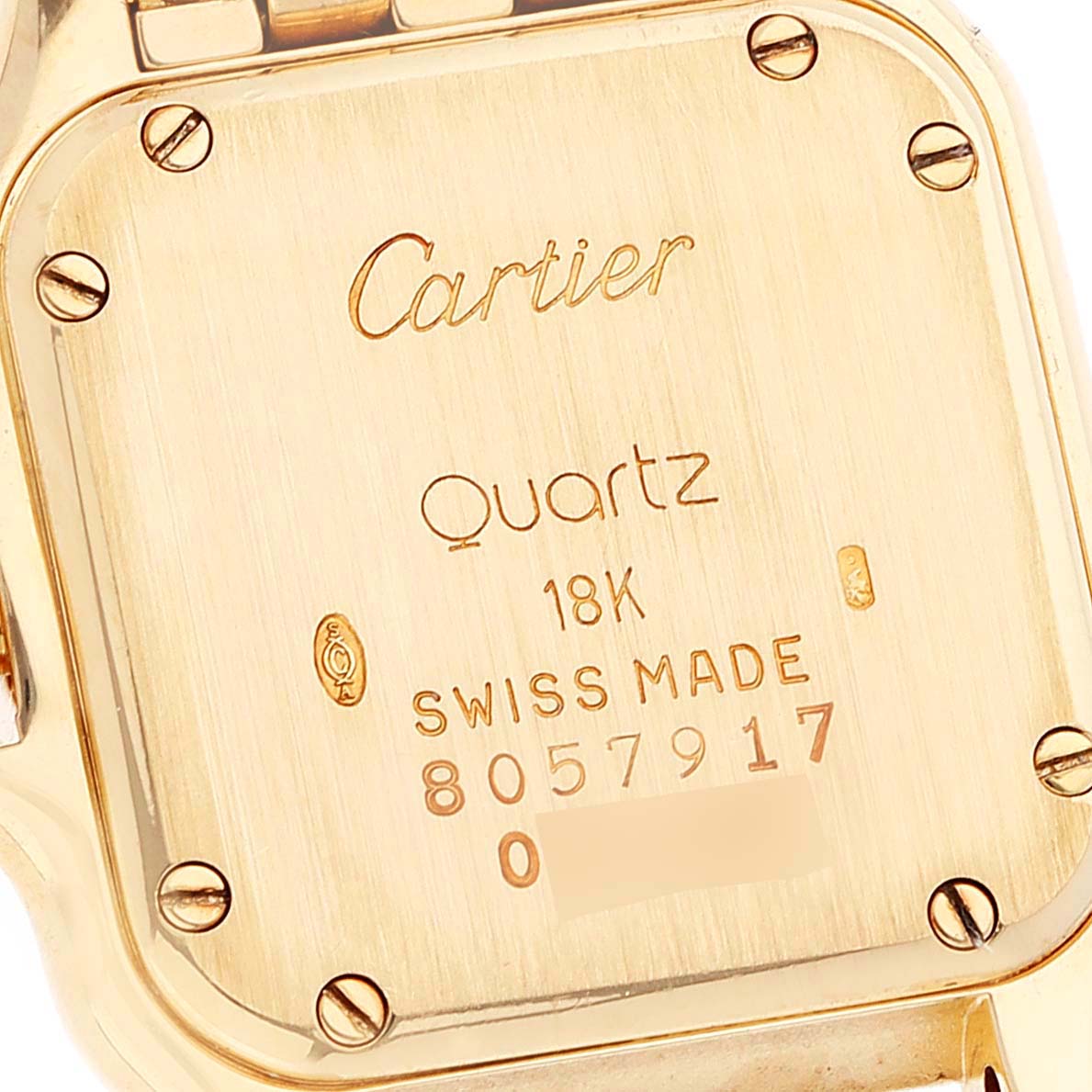 This image shows the case back of a Cartier Panthere W25022B9 Women's Yellow Gold Silver Dial W25022B9 Women's Yellow Gold Silver Dial watch, highlighting its details and inscriptions.