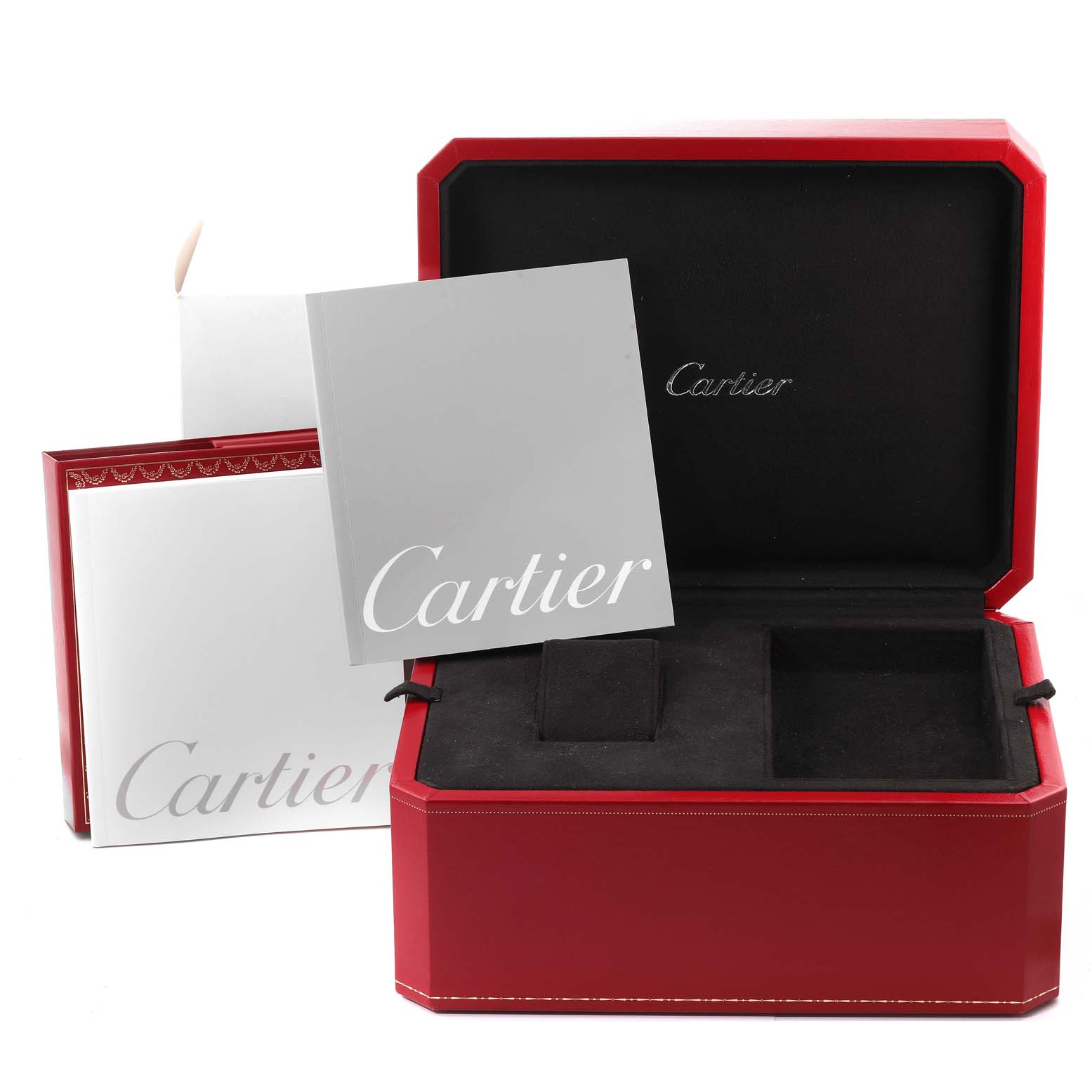 The image shows a Cartier Roadster W62025V3 Men
s Stainless Steel Silver Dial W62025V3 Men
s Stainless Steel Silver Dial watch box, booklets, and red case at an angle with the lid open.