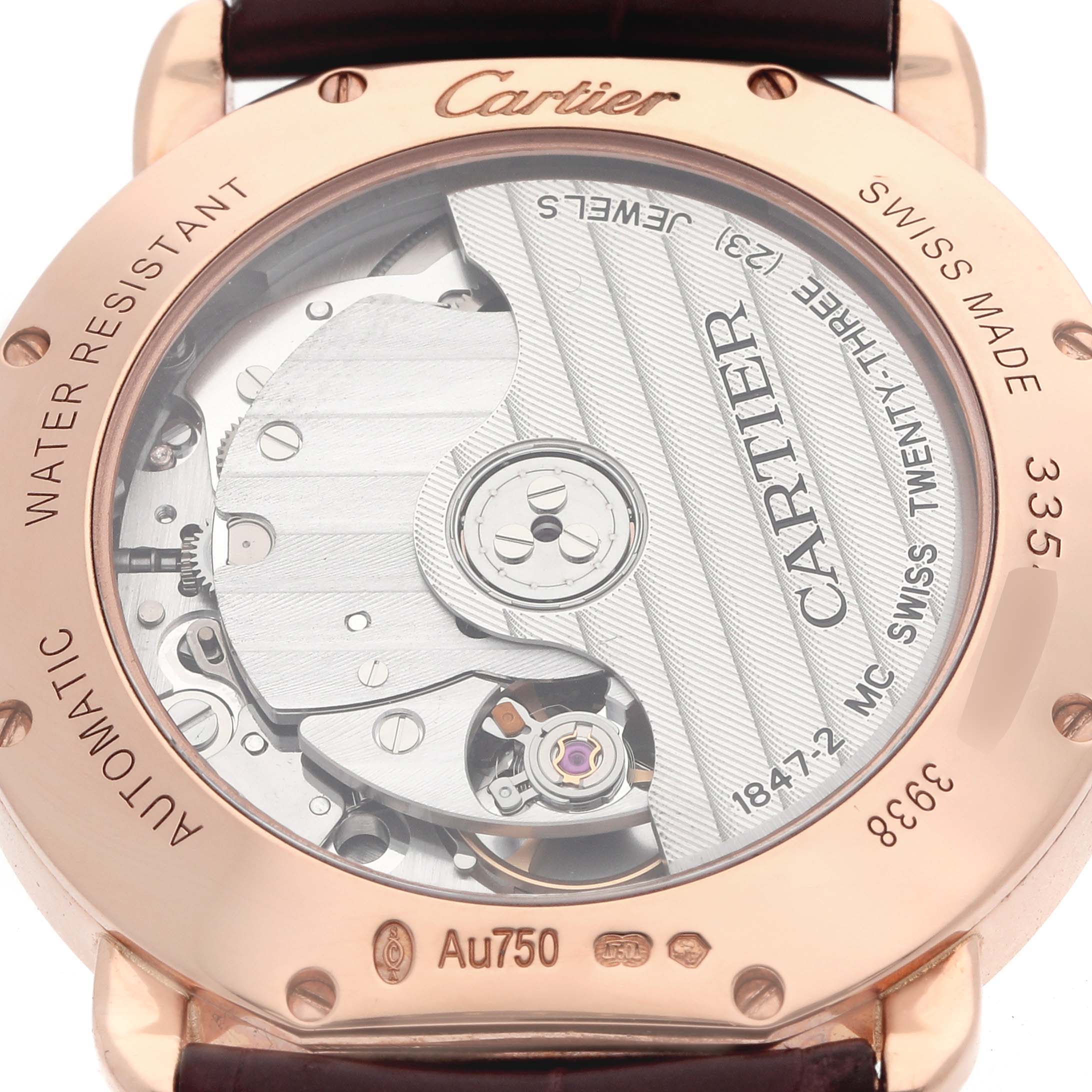 The image shows the back of a Cartier Ronde WGRN0006 Men
s Rose Gold Silver Dial watch, revealing its inner mechanical movement and transparent case back.