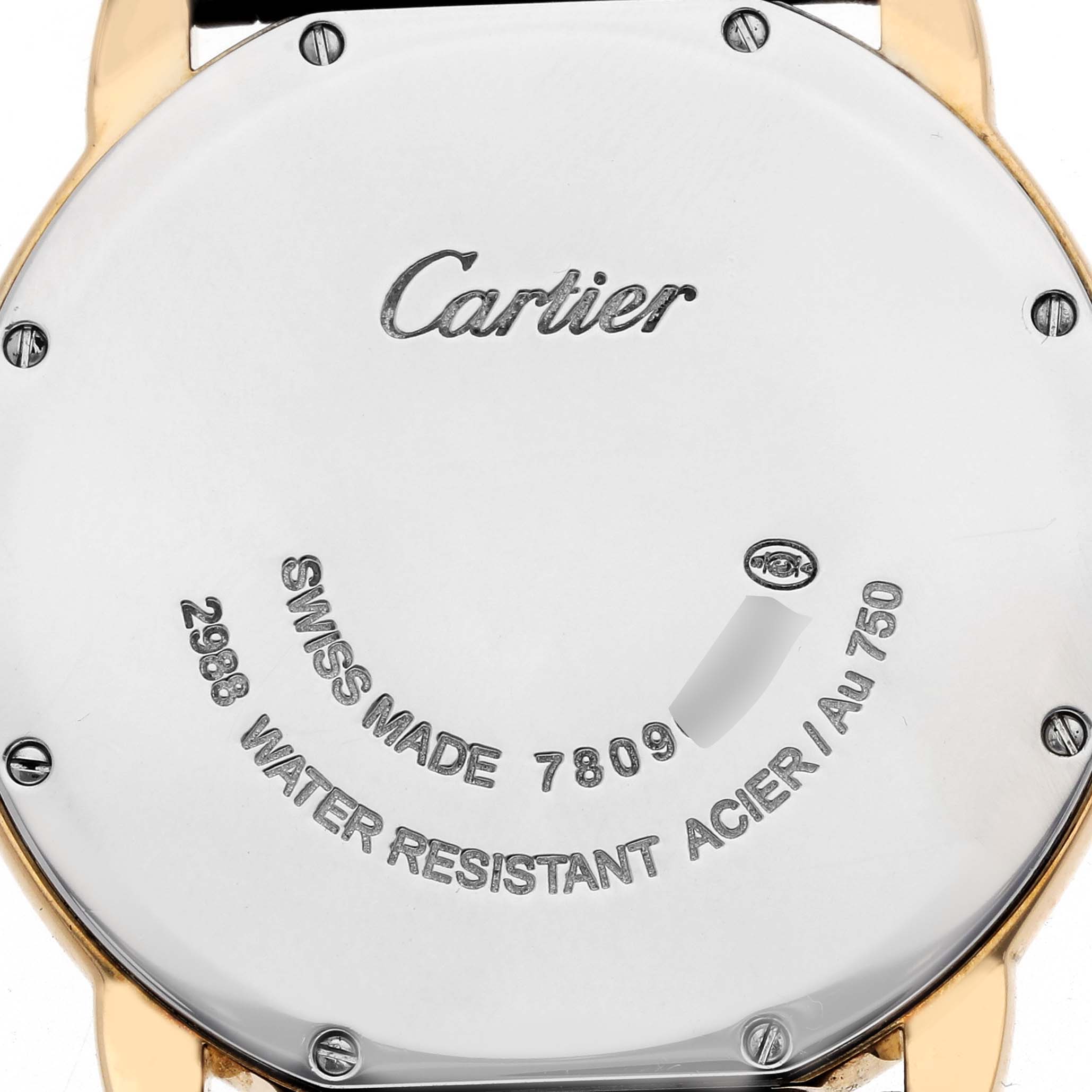 The image shows the back of a Cartier Ronde W6700455 Men
s Steel and Gold (two tone) Silver Dial watch, highlighting its inscriptions and gold accents.