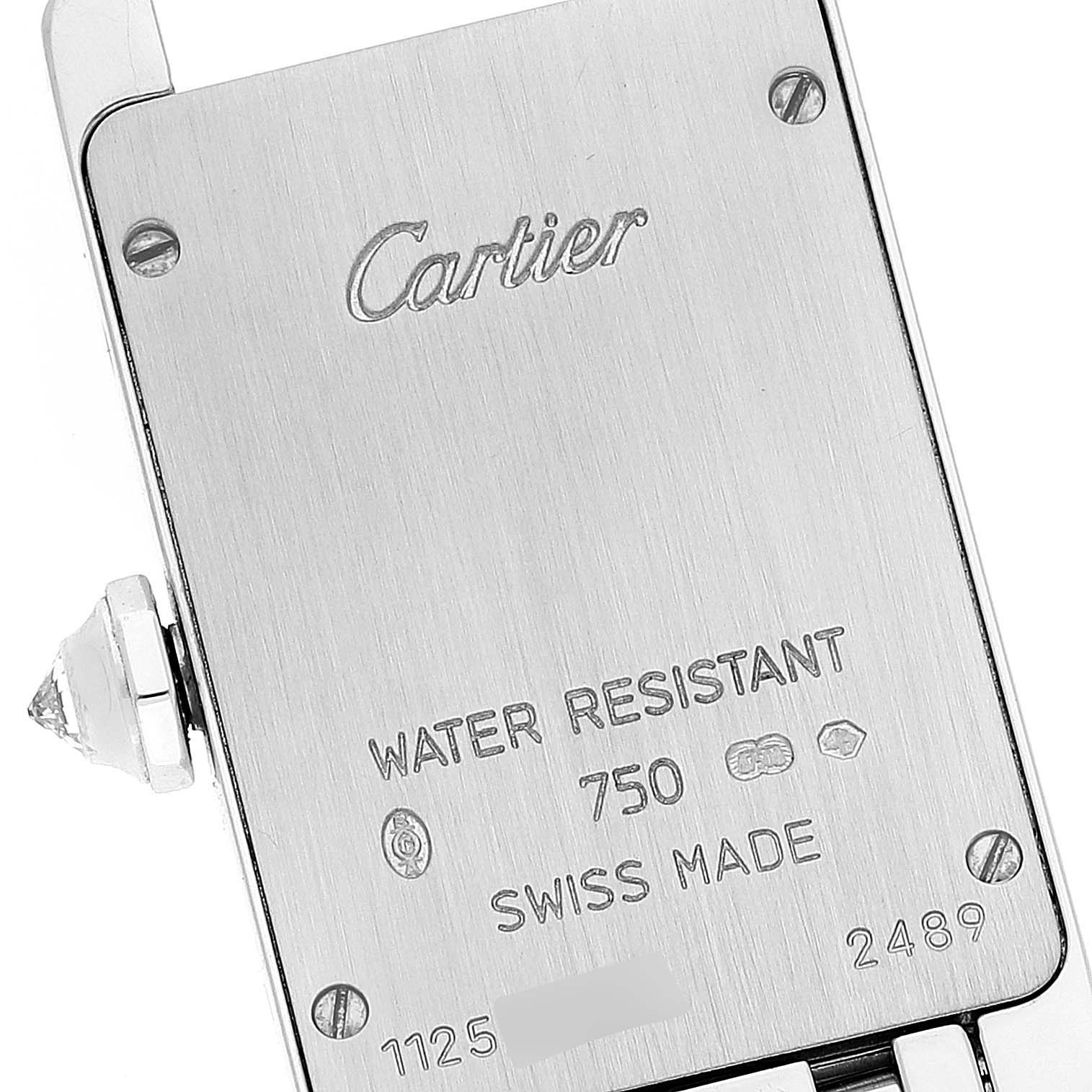 This image shows the back casing of a Cartier Tank Americaine WB7073L1 Women
s White Gold Silver Dial WB7073L1 Women
s White Gold Silver Dial watch, highlighting the brand, model, and specifications.