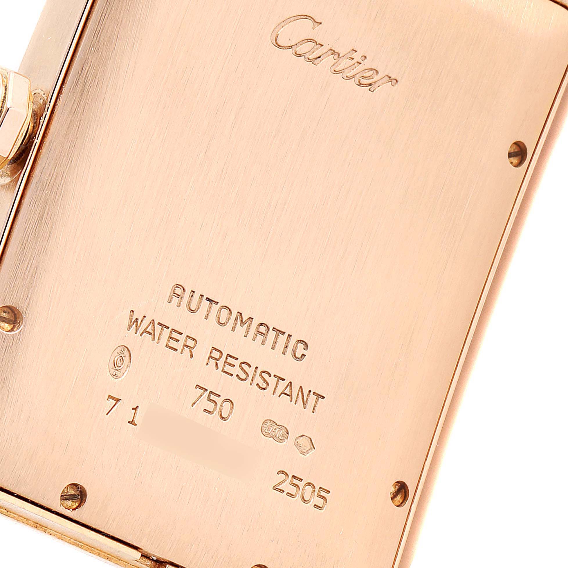 This image shows a close-up of the back case of the Cartier Tank Américaine watch, showcasing its engravings and screws.