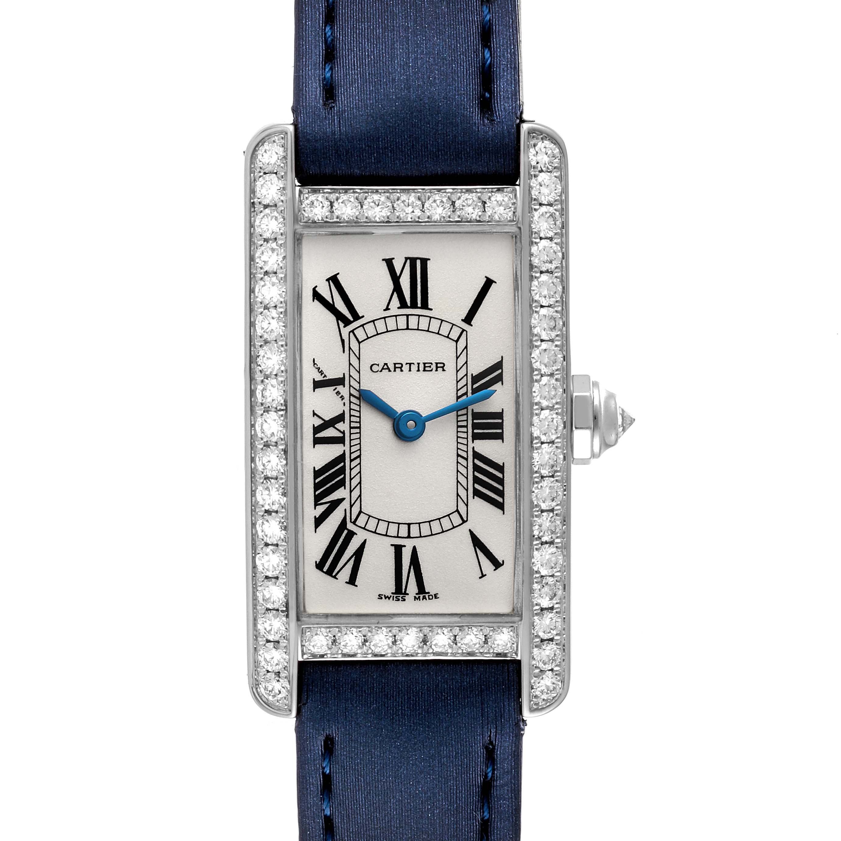 This image shows a Tank Americaine watch by Cartier, viewed from the front, featuring a diamond-set bezel and a blue strap.