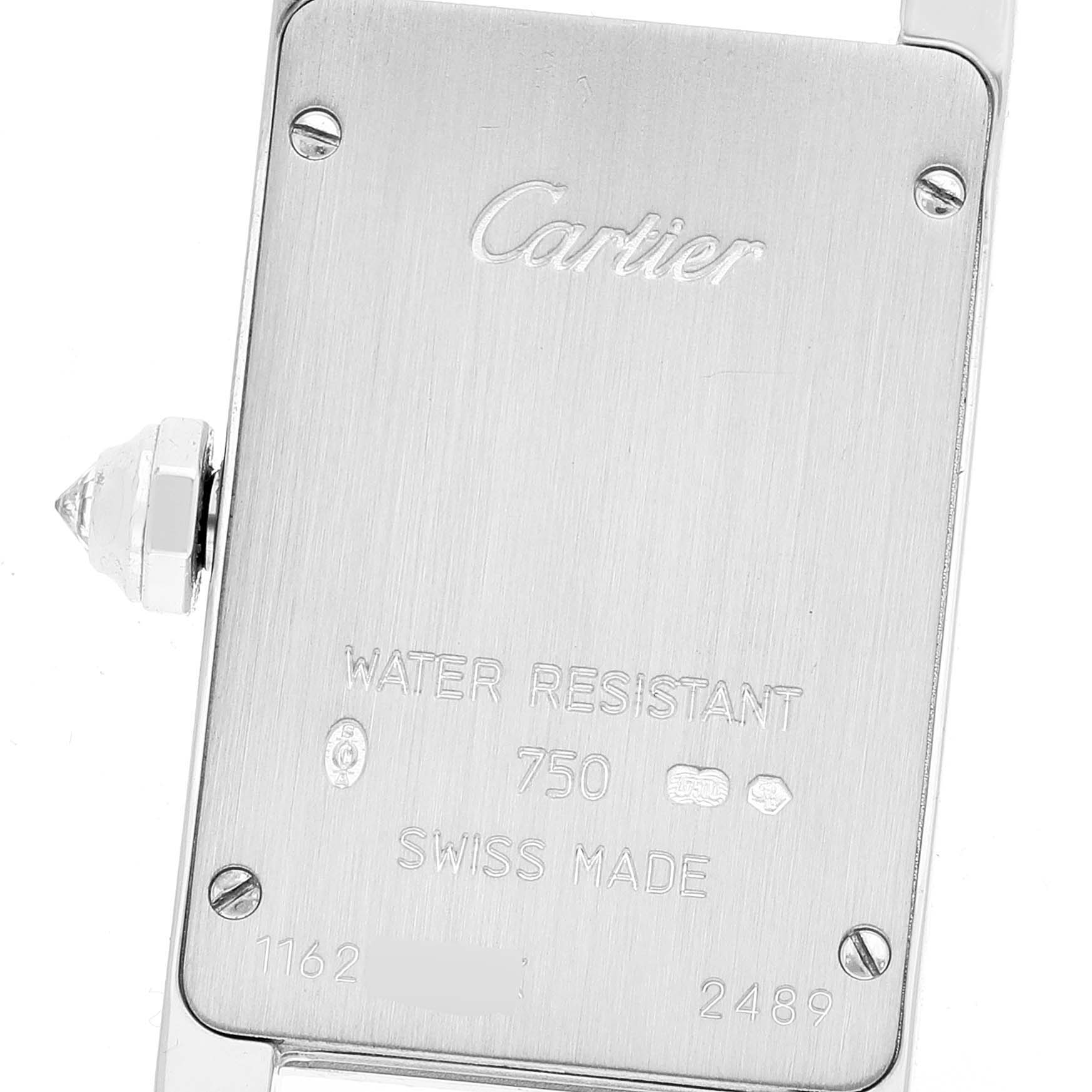 The image shows the case back of a Tank Americaine model by Cartier, along with its branding and specifications.