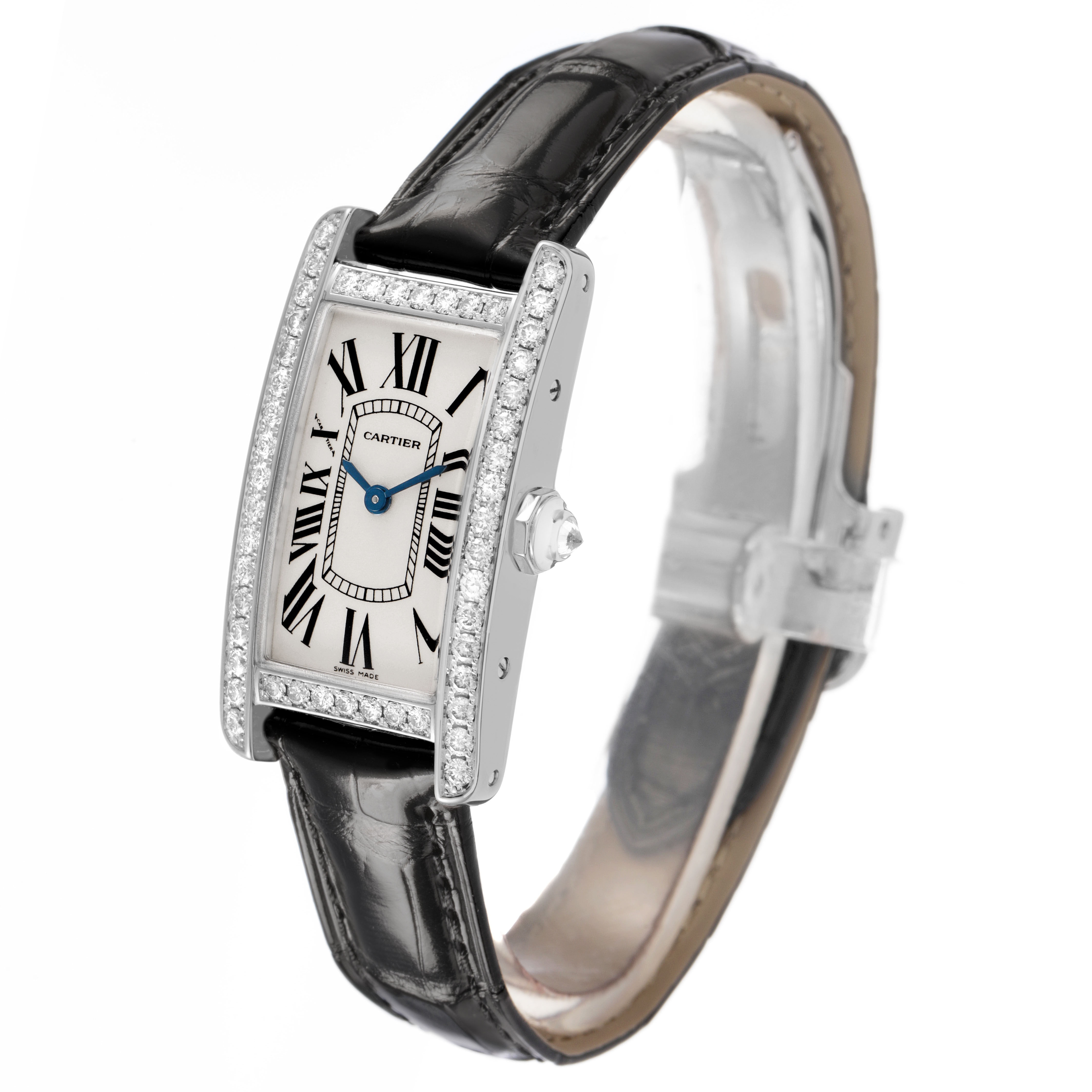 The Cartier Tank Américaine watch is shown at a three-quarter angle, displaying its face, strap, and crown.