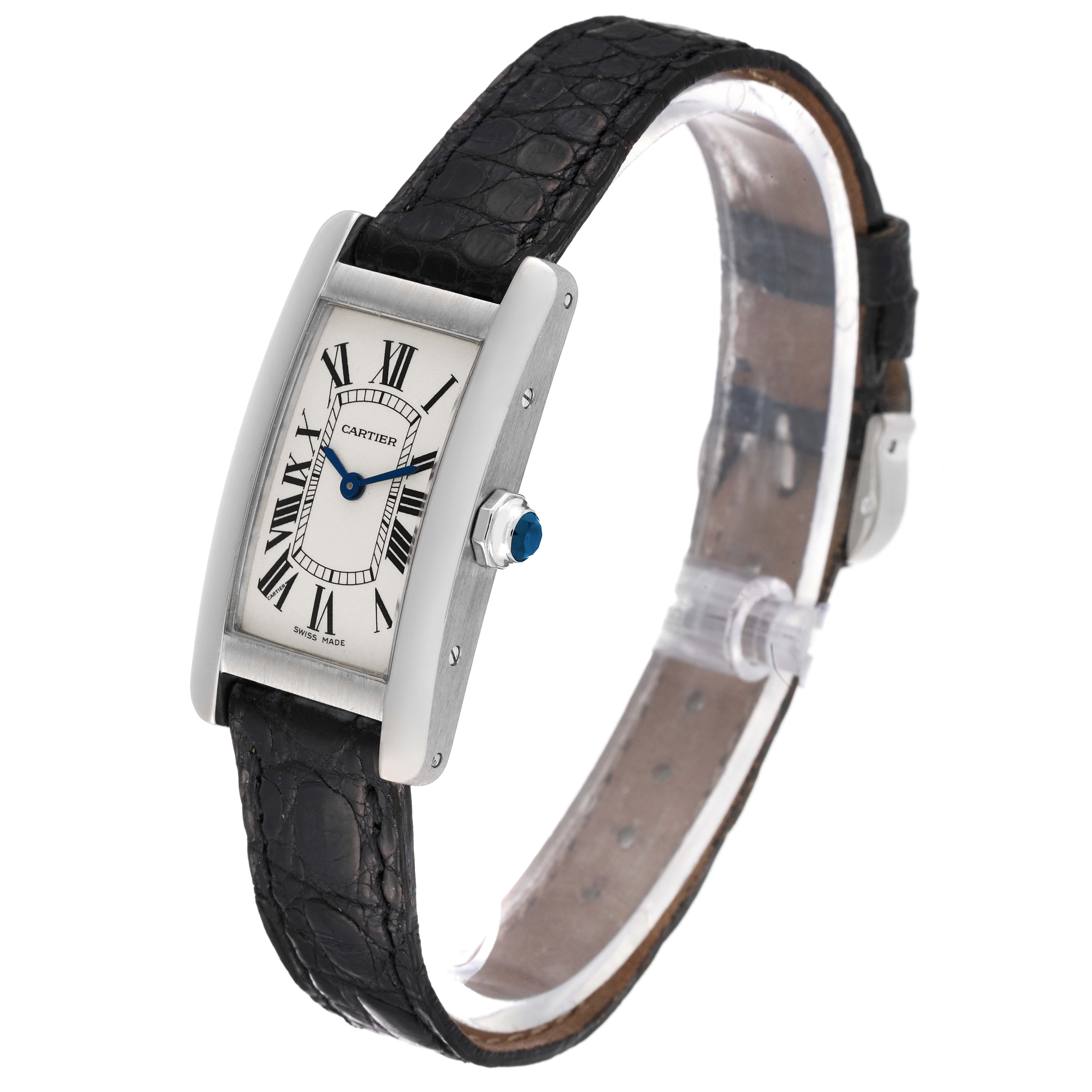 The image shows a Cartier Tank Américaine watch at a three-quarter angle, highlighting the face, crown, and leather strap.