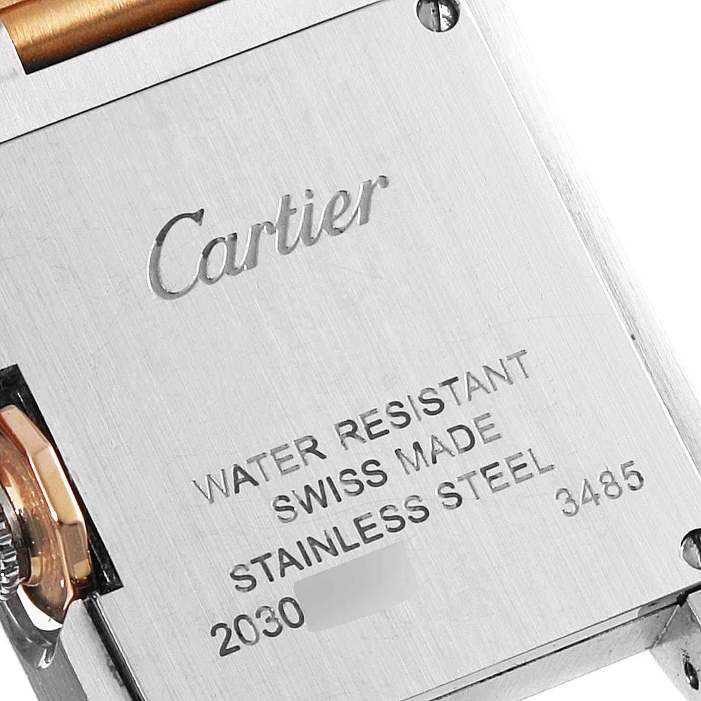 The image shows the back case of a Cartier Tank Anglaise W5310036 Women's Steel and Gold (two tone) Silver Dial W5310036 Women's Steel and Gold (two tone) Silver Dial watch, highlighting engravings of the brand, model details, and water resistance.