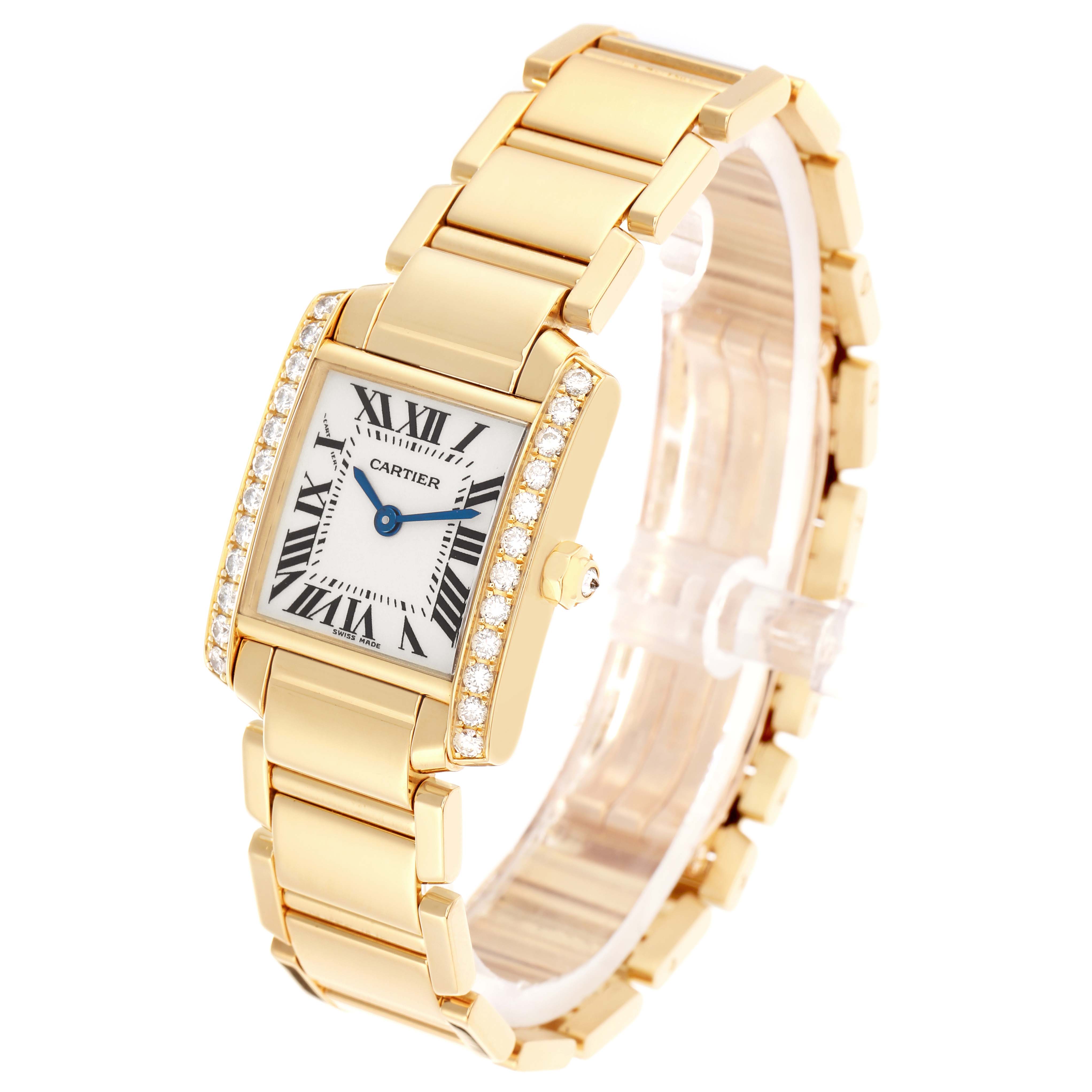 The Cartier Tank Française watch is shown at an angled view, highlighting its gold bracelet, diamond-studded case, and Roman numeral dial.