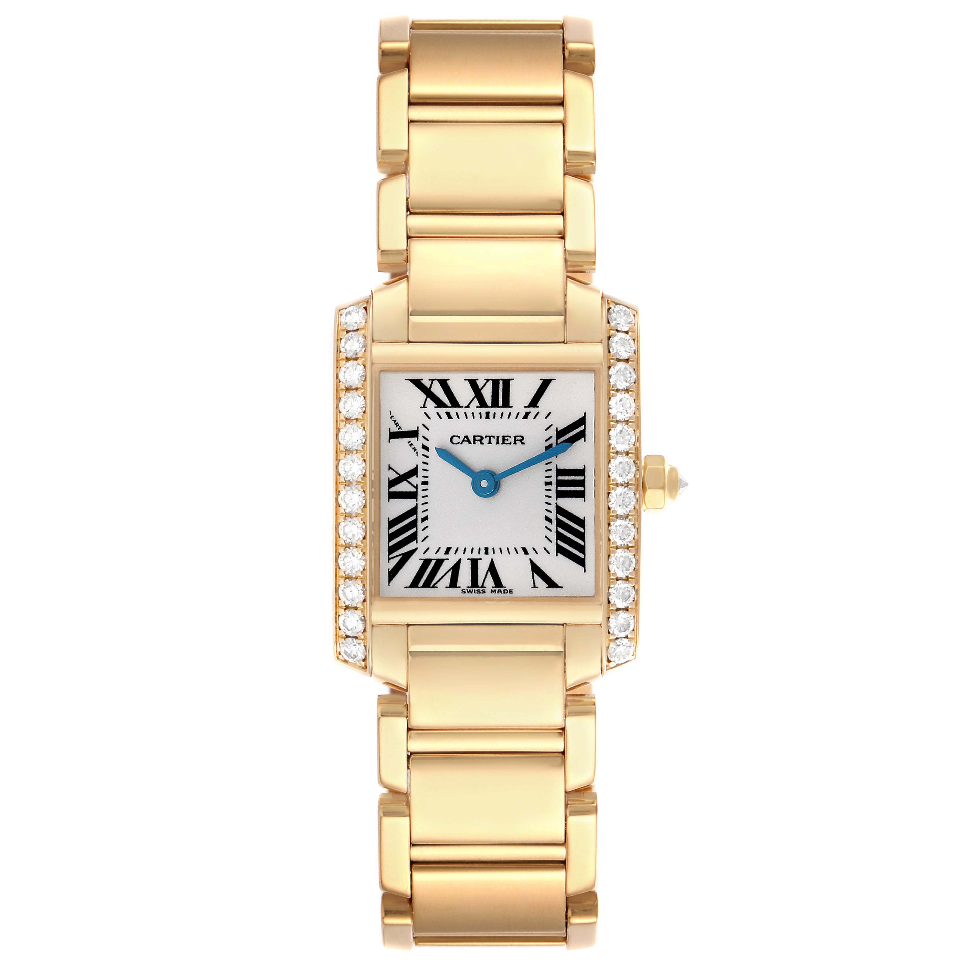 The Cartier Tank Francaise WE1001R8 Women
s Yellow Gold Silver Dial watch is shown from a top-down angle, displaying its rectangular face, gold bracelet, and diamond details.