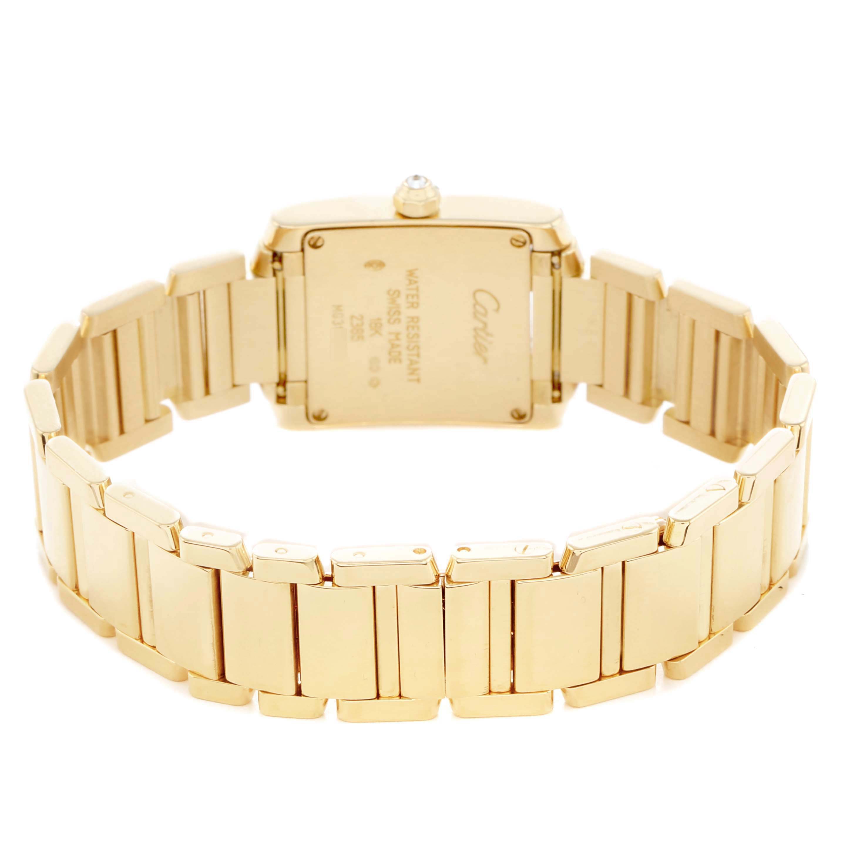 The image shows the back view of a Cartier Tank Française watch, highlighting the clasp and bracelet links.