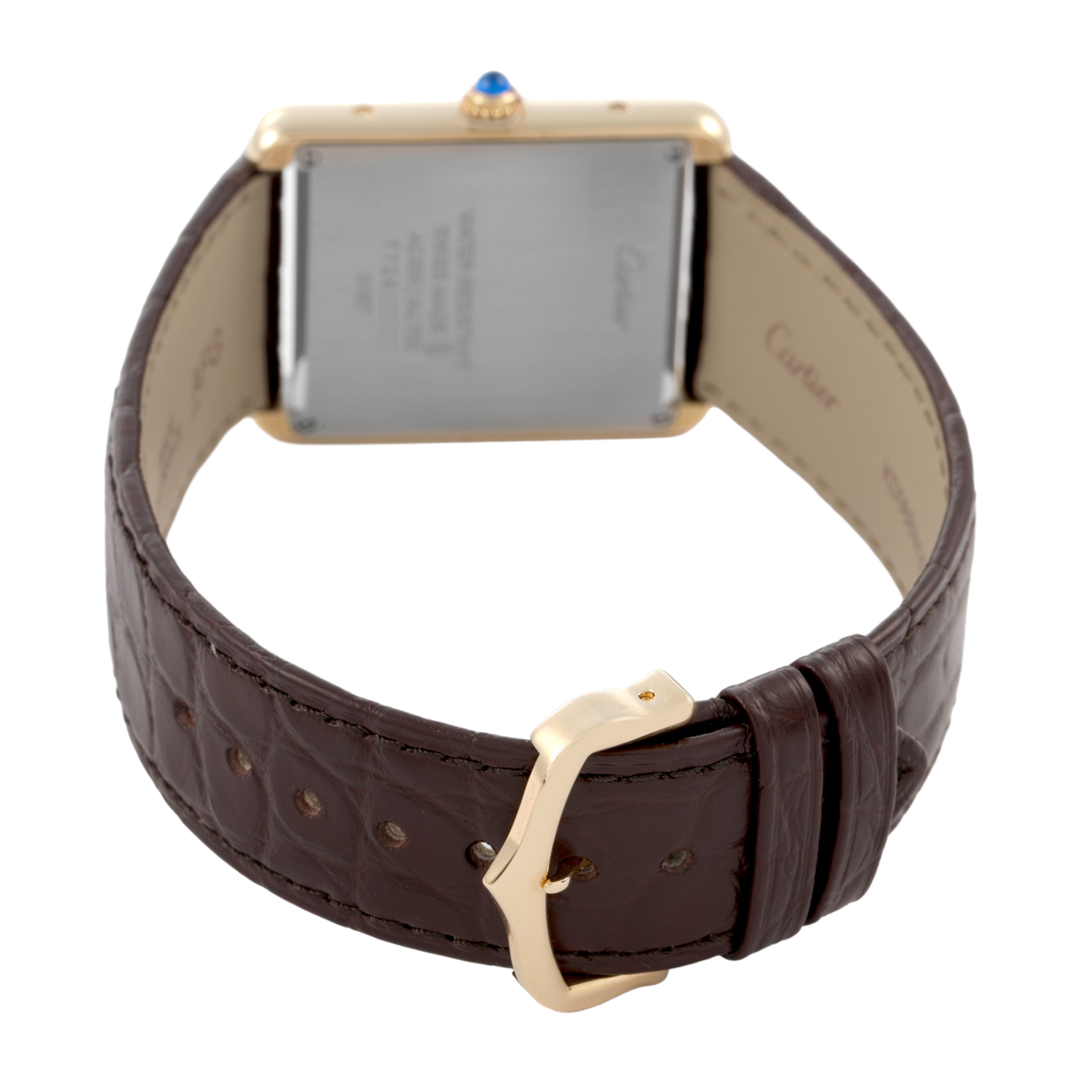 The image shows the back of a Cartier Tank Solo W5200024 Women's Yellow Gold Silver Dial watch, focusing on the case back, leather strap, and gold buckle.